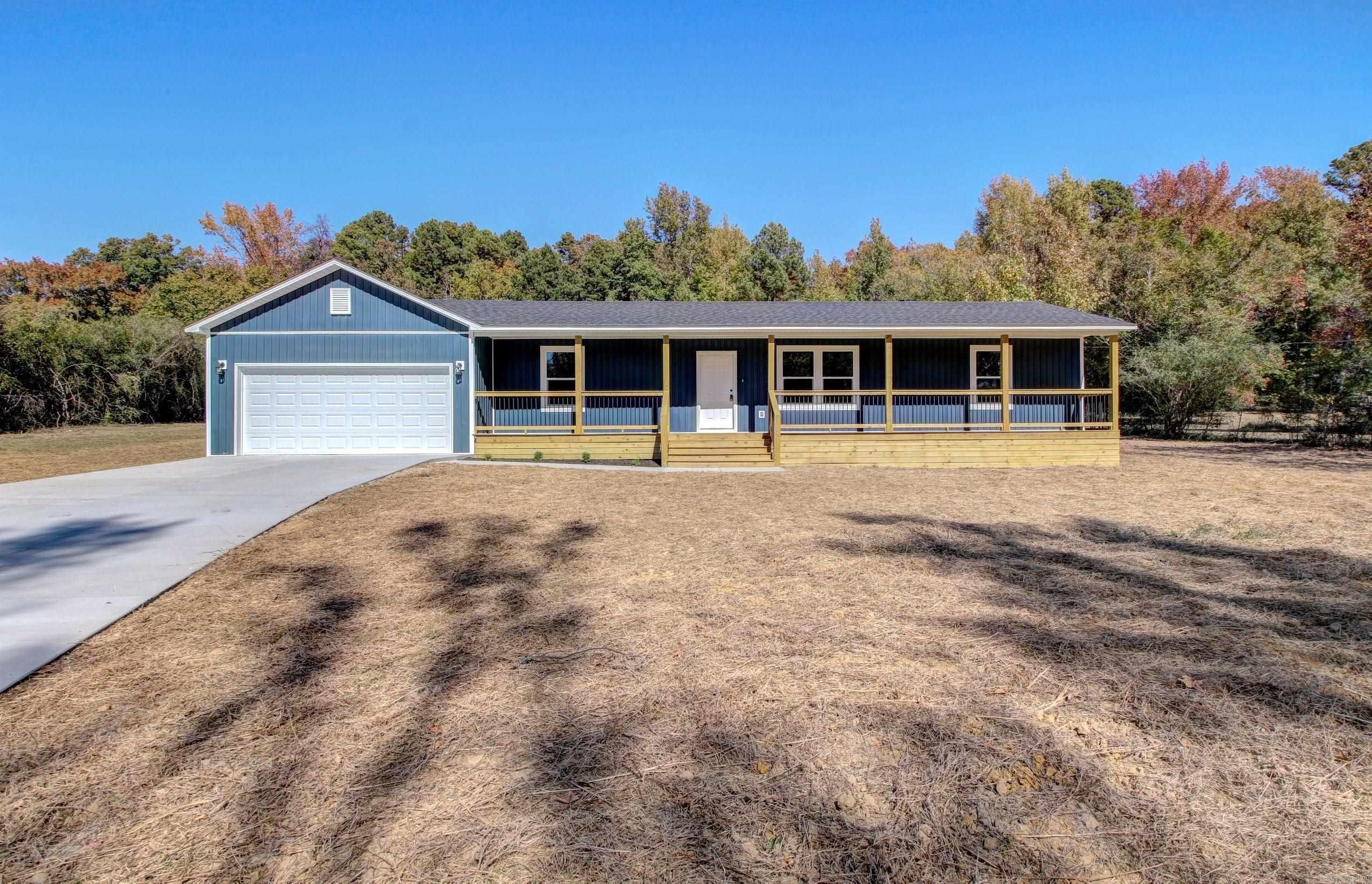 This beautiful fully renovated home located just outside of town on a little over an acre is the perfect place to call home. The all-new front porch spans the length of the home and welcomes you inside. With an open concept living space this makes a perfect place to entertain or cozy up the beautiful electric fireplace that is flanked by an attractive accent wall. No stone was left unturned with new septic, city water to house, new roof, HVAC (including ductwork), new sheetrock, faucets, fixtures, insulation, new fencing, brand new kitchen including SS appliances, all new bathrooms, all new electrical and plumbing, and much more. The property can be accessed from the main road via a newly poured concrete driveway, or from the rear via Angela drive. Storage shed shall convey and the seller left the well to access for lawn maintenance or to add a sprinkler system.  The property is turn-key ready for you to move in... Just in time to celebrate Christmas in your amazing home!!