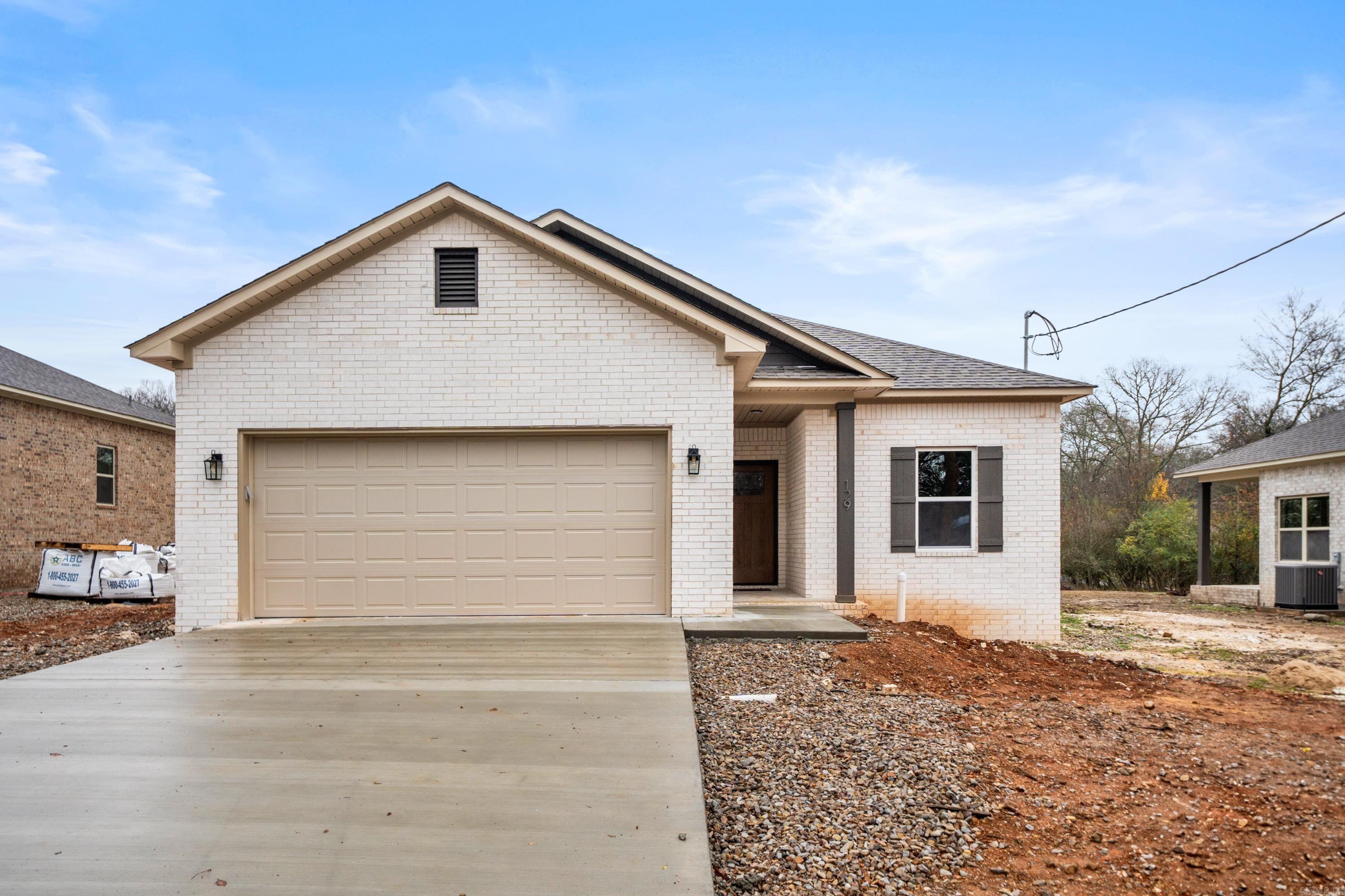 A LANCE LEVI CONSTRUCTION- New Quality Built Home!! Immaculate, new construction home is a true showcase of modern luxury and craftsmanship. This 3-bedroom, 2-bath all electric home, including the water heather & central heat, offers the perfect blend of style, comfort, and functionality. With luxury vinyl plank flooring by Shaw and granite/quartz countertops, in kitchen and baths, the interior is designed with an elegant, contemporary feel. The home features 9-foot ceilings that create an airy, open atmosphere, while insulated doors and walls enhance energy efficiency. The primary suite is a private retreat, complete with a luxurious walk in shower. The exterior is equally impressive, with a striking brick facade with vinyl soffit & metal fascia, and a fiberglass front door that provides both durability and curb appeal. Enjoy the convenience of a 2-car garage with insulated walls & doors, a covered back patio, and a sprinkler system on its own meter, ensuring the lush landscaping is always well-maintained. Whether you're looking for a stylish new home or a practical space with all the modern amenities, this property is a must-see.