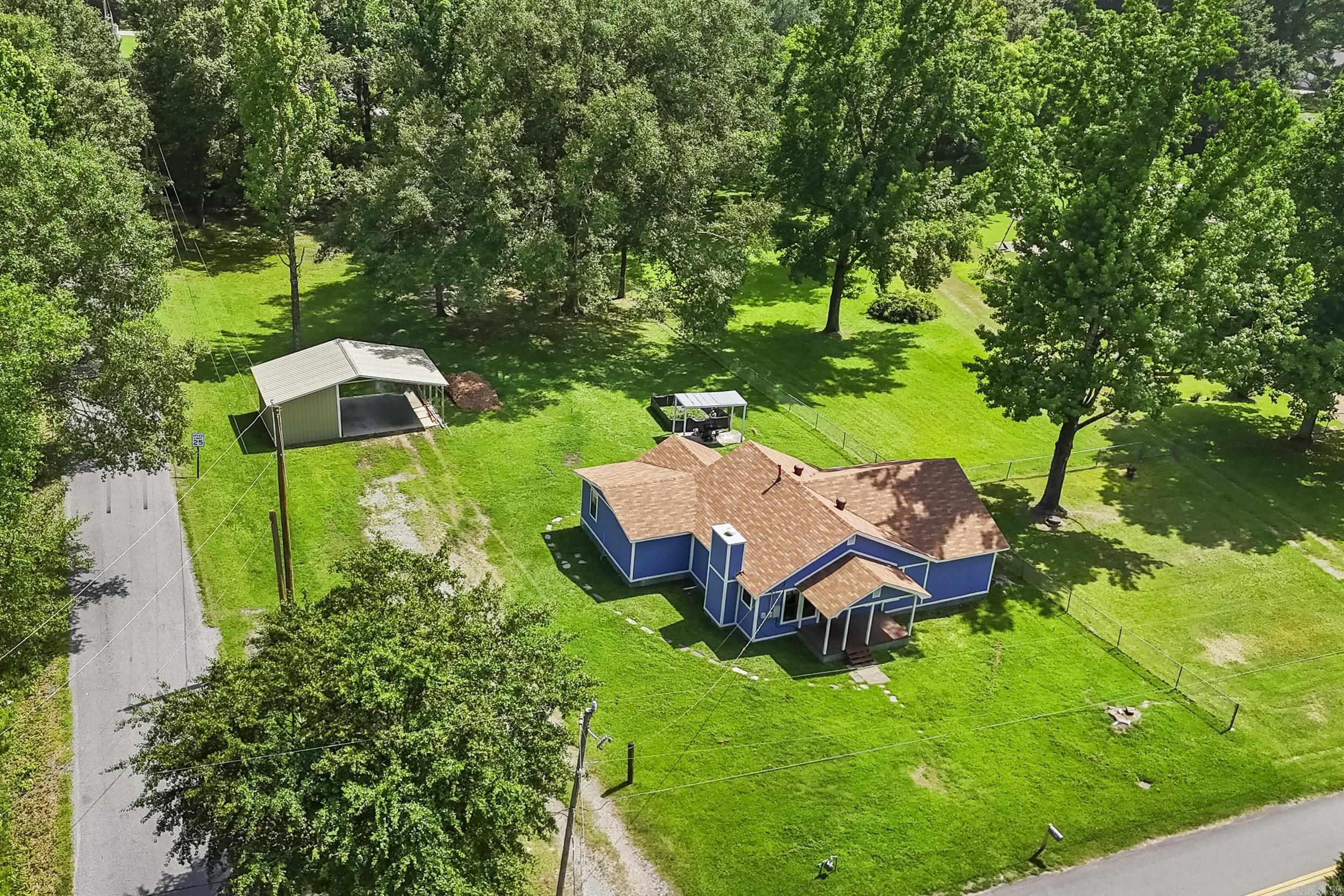 Located in the East End area, this great one-story property offers a county-style setting with plenty of space inside and out. Sitting on a level corner lot that is almost an acre, the home gives you room to enjoy a large yard, plant your own vegetable garden, or simply have extra outdoor space to spread out. The third bedroom could also make a great office, hobby room, or flex space to fit your needs. A new roof was added in 2023, giving peace of mind for the next owner. The property also includes a shop/carport with an overhead door, making it perfect for storage, tools, lawn equipment, or projects. With its spacious lot, useful extras, and room to enjoy the outdoors, this home is a great opportunity in a Rural Development loan eligible area.