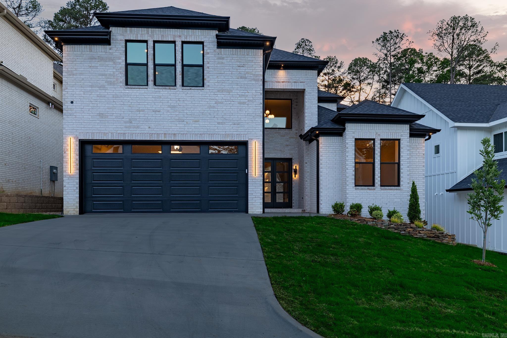 Experience elevated living in this exceptional new construction home in a sought-after West Little Rock community. Designed for luxury and functionality, this residence offers 4 spacious bedrooms, a versatile 5th room (office/media/flex), and 4.5 beautifully appointed baths.  The open-concept layout showcases gorgeous engineered hardwoods, soaring ceilings, designer finishes, and abundant natural light. A chef-inspired kitchen features custom cabinetry, quartz countertops, a large center island, a walk-in pantry, and an innovative "Costco Door" for direct grocery unloading from the garage.  Modern tech and amenities abound, including a 100-AMP EV charger, an insulated garage, security camera pre-wiring, a smart MyQ garage door opener with a camera, USB/USB-C outlets, and 360-degree directional LED gimbal lighting.  Additional features include double-wide front doors, an oversized sliding glass door, excellent storage, and a professionally stained, covered back porch perfect for outdoor enjoyment. Exceptional luxury finishes and thoughtful details make this home truly stand out. Schedule your private tour today!