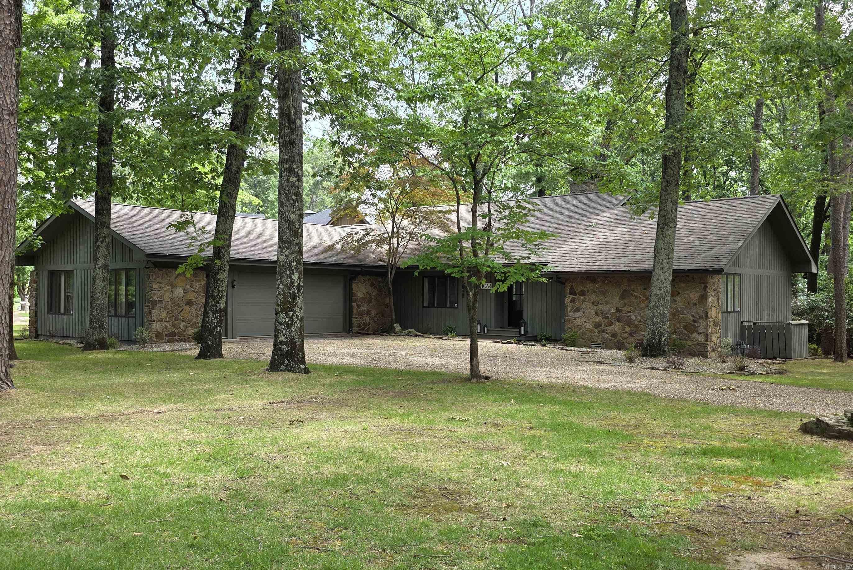Eden Isle LAKEVIEW home on Fox Chase Road!  This lovely 3-bedroom/3-bath home has been completely updated and is completely furnished!  Located just north of Eden Isle Marina, this is a highly sought after location with great lake views, large open floorplan, cathedral ceilings and stone fireplace, 2 wet bars (one with drink refrigerator and wine refrigerator), split bedroom plan, very large 2-car garage, lovely covered back deck and tons of glass!  Inside and out...all is in excellent condition!