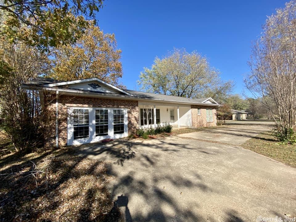Spacious brick home ready for you and your family to move into! 3-bedroom 2 bath with a large separate utility room just off the kitchen. Large living room with beautiful large windows to see the outside surroundings and partial mountain views. Back deck as well as a storm shelter just off the back deck and an outbuilding that will convey.  Close to town and within a couple of miles of the White River.