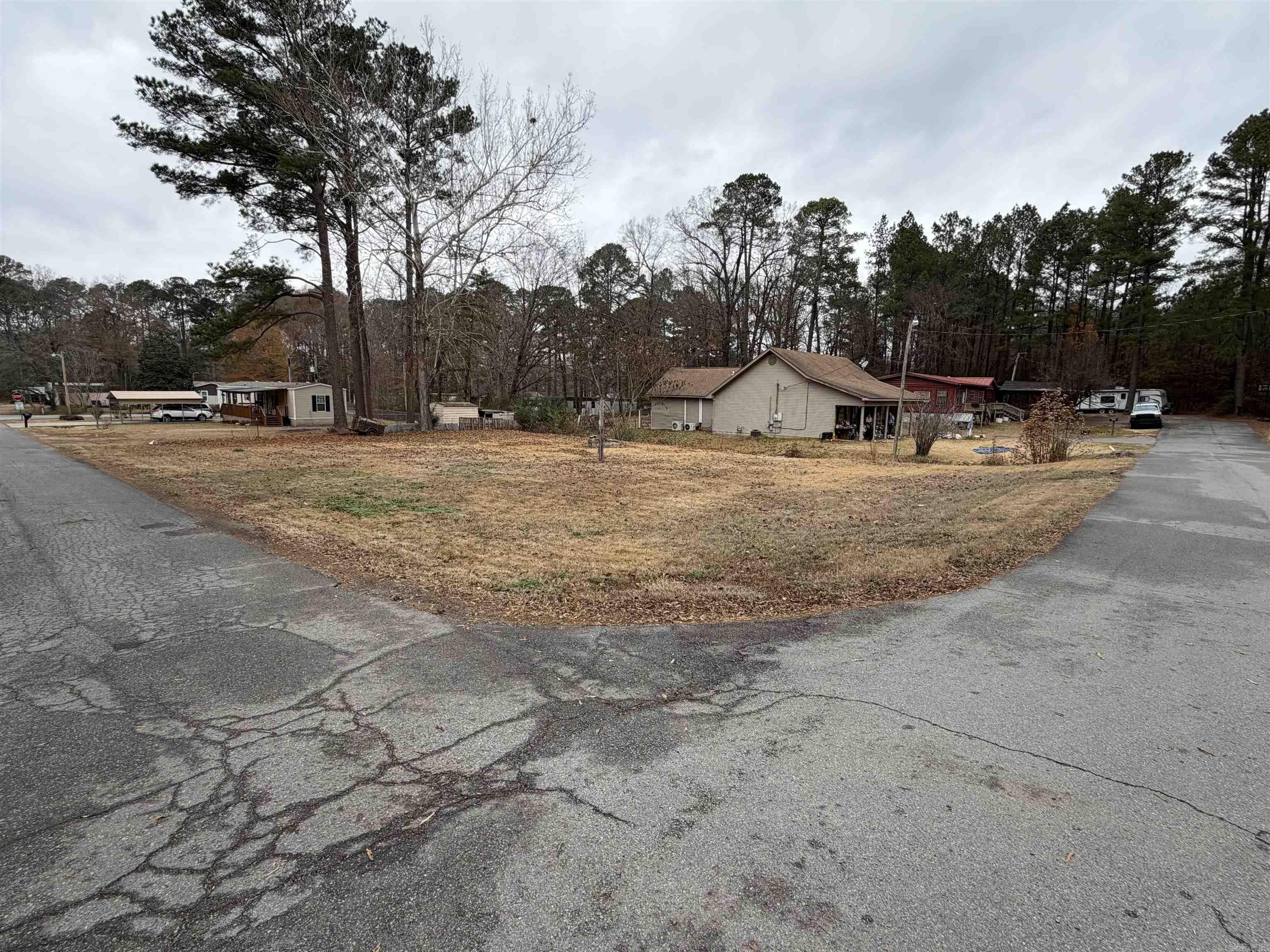 This beautiful flat corner lot offers a peaceful and picturesque setting with a quaint creek running along the edge of the property, creating the perfect tranquil backdrop for your future dream home. Conveniently located close to shopping, restaurants, and the interstate, you’ll enjoy easy access to everything you need while still being just far enough away from the hustle and bustle to relax and unwind at home. Come see this ideal, buildable lot and imagine the possibilities!