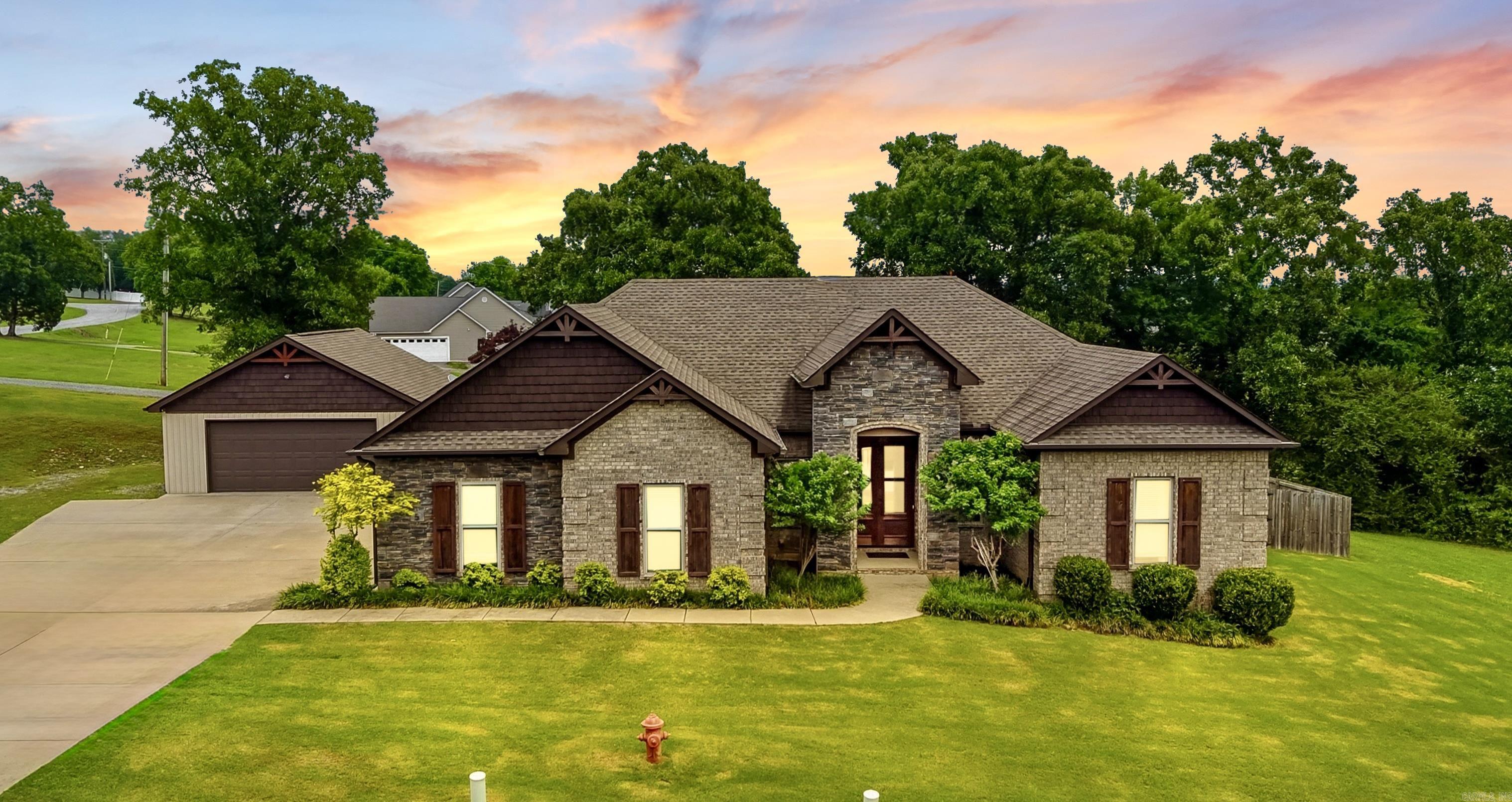 If you’ve been waiting on something in the Spring Hill area, this one deserves a look! This home sits on a very pretty lot in a sought after location right off of Arkavalley Rd. with easy access to Greenbrier, Conway, and the nearby private airstrip. Inside, the home has a clean open concept feel with tall ceilings, beautiful cabinets and countertops, a walk in shower, large walk in closet, and a roomy bathroom vanity area. Out back is where this property really separates itself with a fenced backyard, big deck, and a 24x24 shop with electric on a slab. The shop connects to the backyard through a side door, making it easy to use for projects, storage, hobbies, or whatever extra space you’ve been needing. This place has so much to offer!! Great location, great setup, and a home that’s been kept in good shape! Don't let this one slip by!!