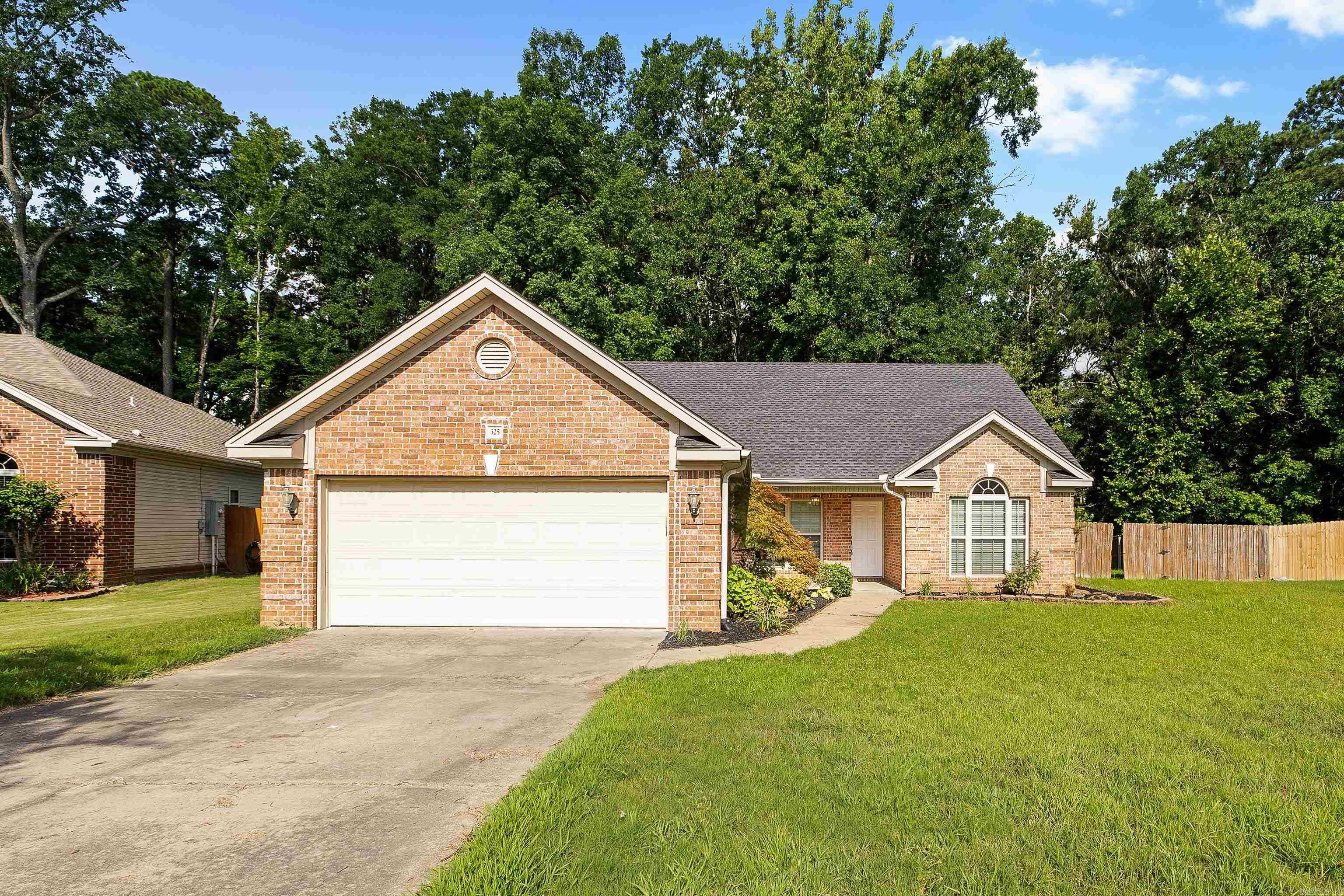 Great 3 bedroom, 2 bathroom home in the Benton School District! Tucked on the edge of a cul-de-sac in a great neighborhood, this beautifully updated home is truly move-in ready, with fresh paint, new fixtures, new flooring in the bedrooms, and a brand new roof! The split floor plan offers privacy and functionality, while vaulted ceilings and a cozy gas fireplace give the living room a warm, welcoming feel. The eat-in kitchen with breakfast bar is perfect for casual meals, and the master suite impresses with a tray ceiling and a spacious bath featuring a double vanity, jetted tub, and separate shower. Out back, enjoy a private, flat yard backing up to green space. A must see! See agent remarks.