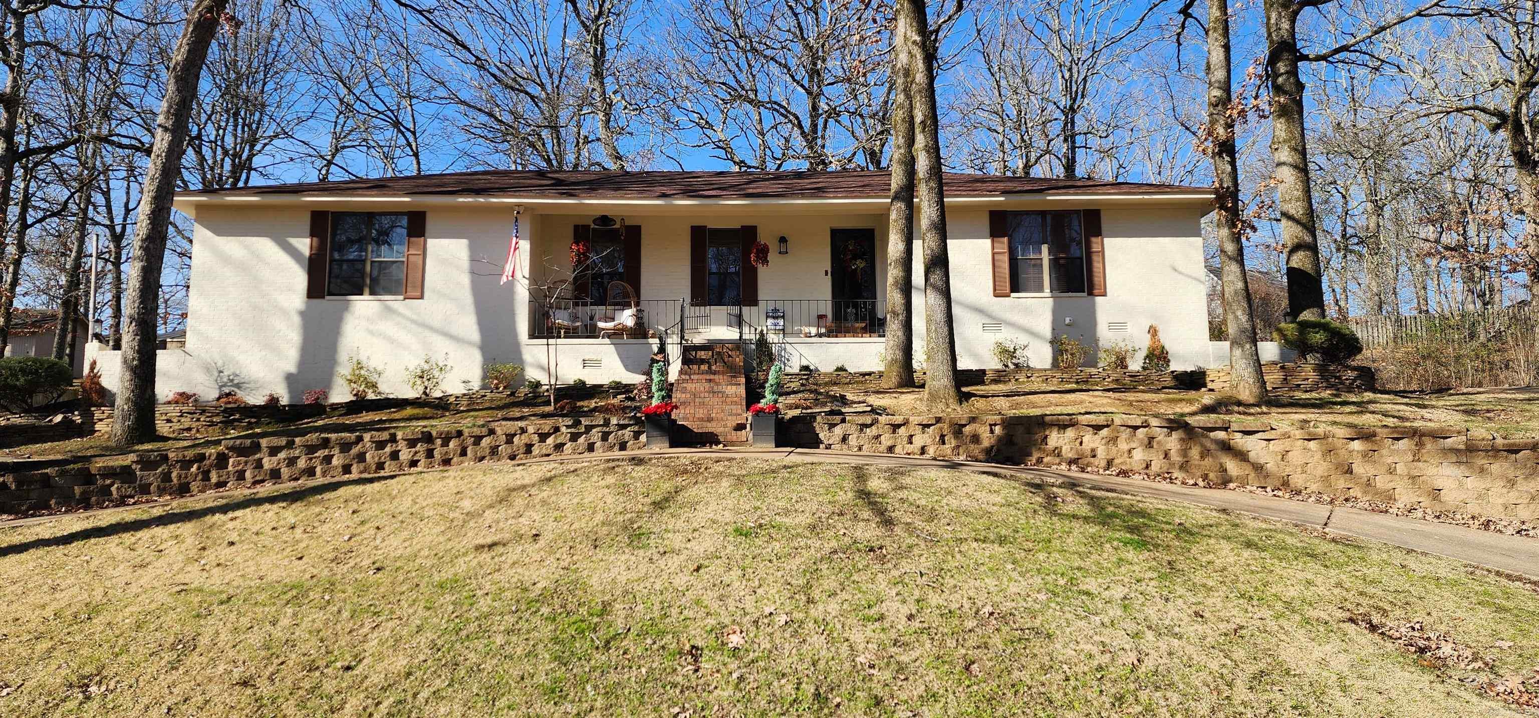Back on the market through no fault of the home...AT A LOWER PRICEPOINT  Inside this home you will find 4 bedrooms for the entire family to have their own space.  There is also 2 living areas featured in the home.  The 2nd with beautiful built in bookshelves and exposed wood beams.  One of the best features of the home is the additional sunroom that can be used as a 3rd living room, expanded laundry, man-cave, game room, or whatever you can imagine. There is no shortage of things to like about this home. The kitchen features plenty of cabinet space along with a breakfast bar. Step outside and you will find a multi-tiered yard large enough for entertaining. The unique layout of the property is also something to be admired. Come take a look at this beautiful home in one of the most desirable neighborhoods in Wynne.