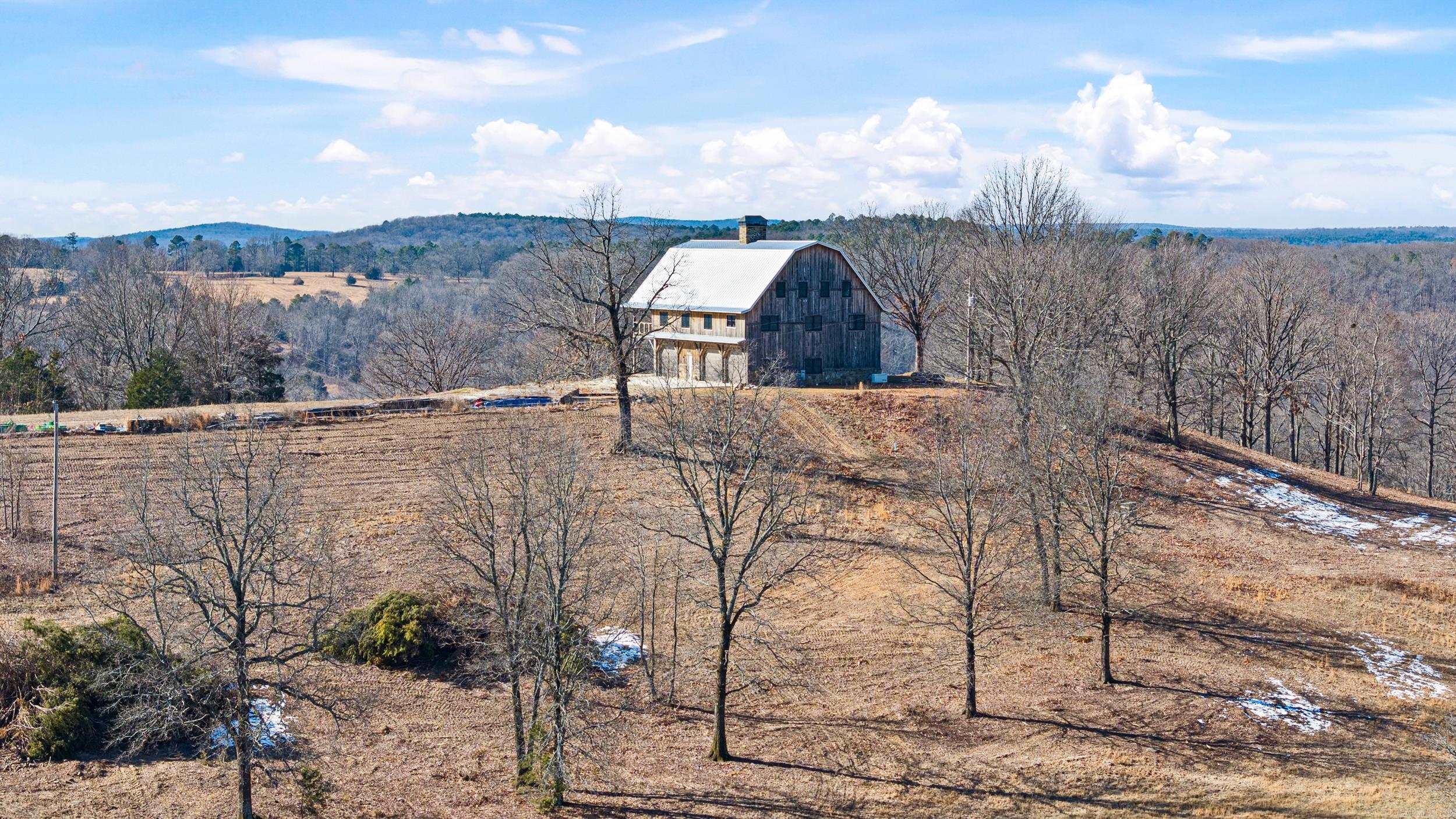 This is a once in a lifetime opportunity! The Snowlick Mountain Ranch includes 317.78 Acres and Panoramic views for miles. With roughly 100 Acres of manicured fields, 4 ponds and the remaining prime hunting ground with napier creek running along the southern border. This tract was previously a high fence ranch with miles of 8 foot fence still remaining. The Brand New Custom built (Timber Frame) Cabin is like something you'll only see from a magazine. Every Log, board and Peg that built this Cabin was harvested from this property, it's so incredible to see the craftsmanship and perfection that went into this build. The Cabin is 5,600 Sqft Heated and Cooled with the garage area included. Upstairs in the main living area is 2,800 Sqft 2 Bedrooms and 3 Full bathrooms. THIS WILL NOT LAST LONG!