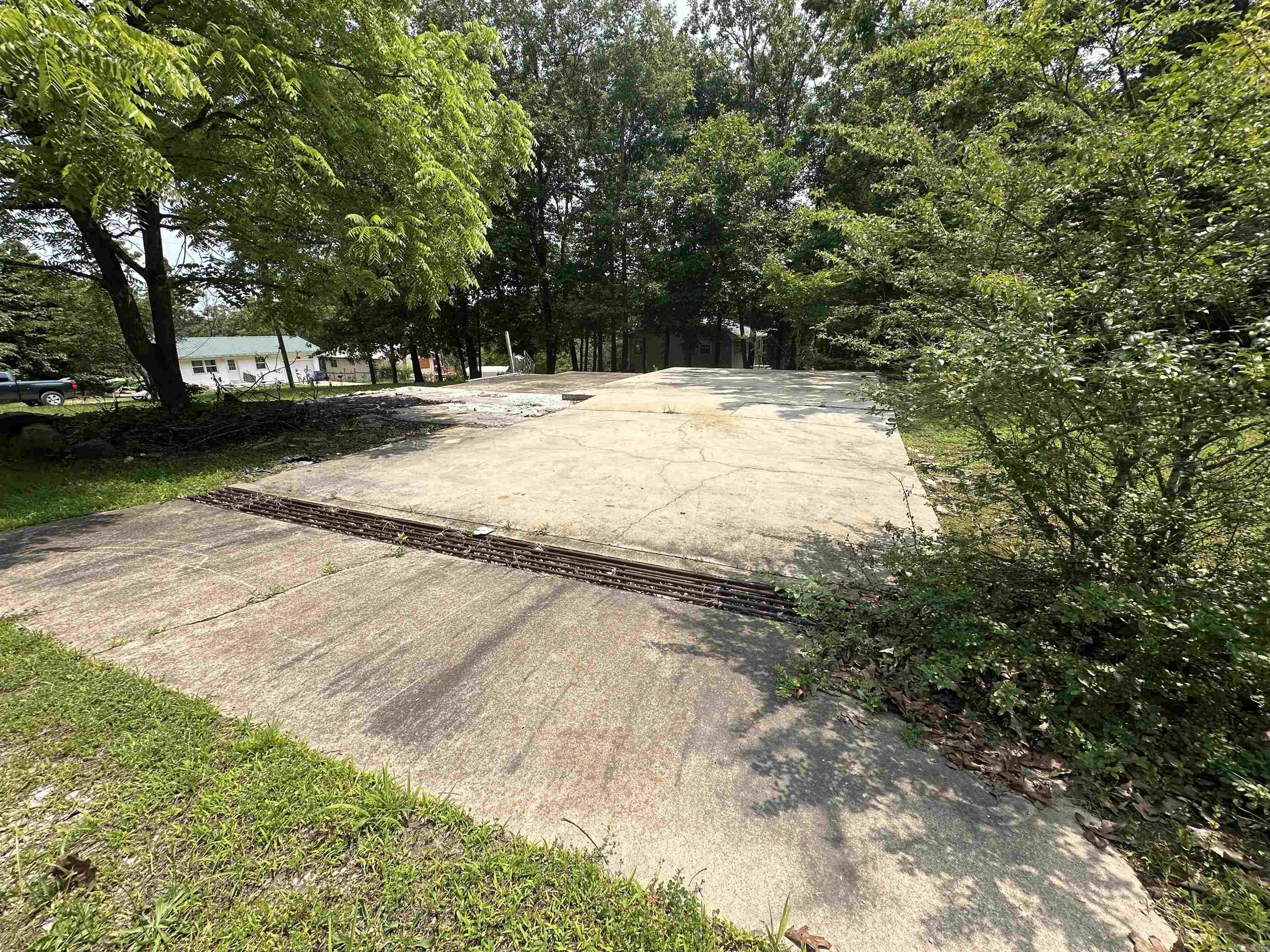 If you've been searching for a ready-to-build lot near Bull Shoals Lake without the hassle of starting from zero, this one is worth a close look. Located in Cedar Heights subdivision in Diamond City, Arkansas, this lot sits directly on State Highway 7/Diamond Boulevard — one of the area's primary corridors — offering high visibility, paved road frontage, and immediate access to everything the Bull Shoals Lake region has to offer. The infrastructure work is already done, which is one of the biggest hidden costs buyers run into with raw land. Concrete pad — ready for construction or use as-is for parking or a temporary setup. Electric service on site and connected. Water and sewer hookups already established. Paved road frontage directly off Diamond Blvd. Whether you're building now, planning for the future, or holding as an investment, this is a low-friction entry point into one of Arkansas's most desirable recreational regions.