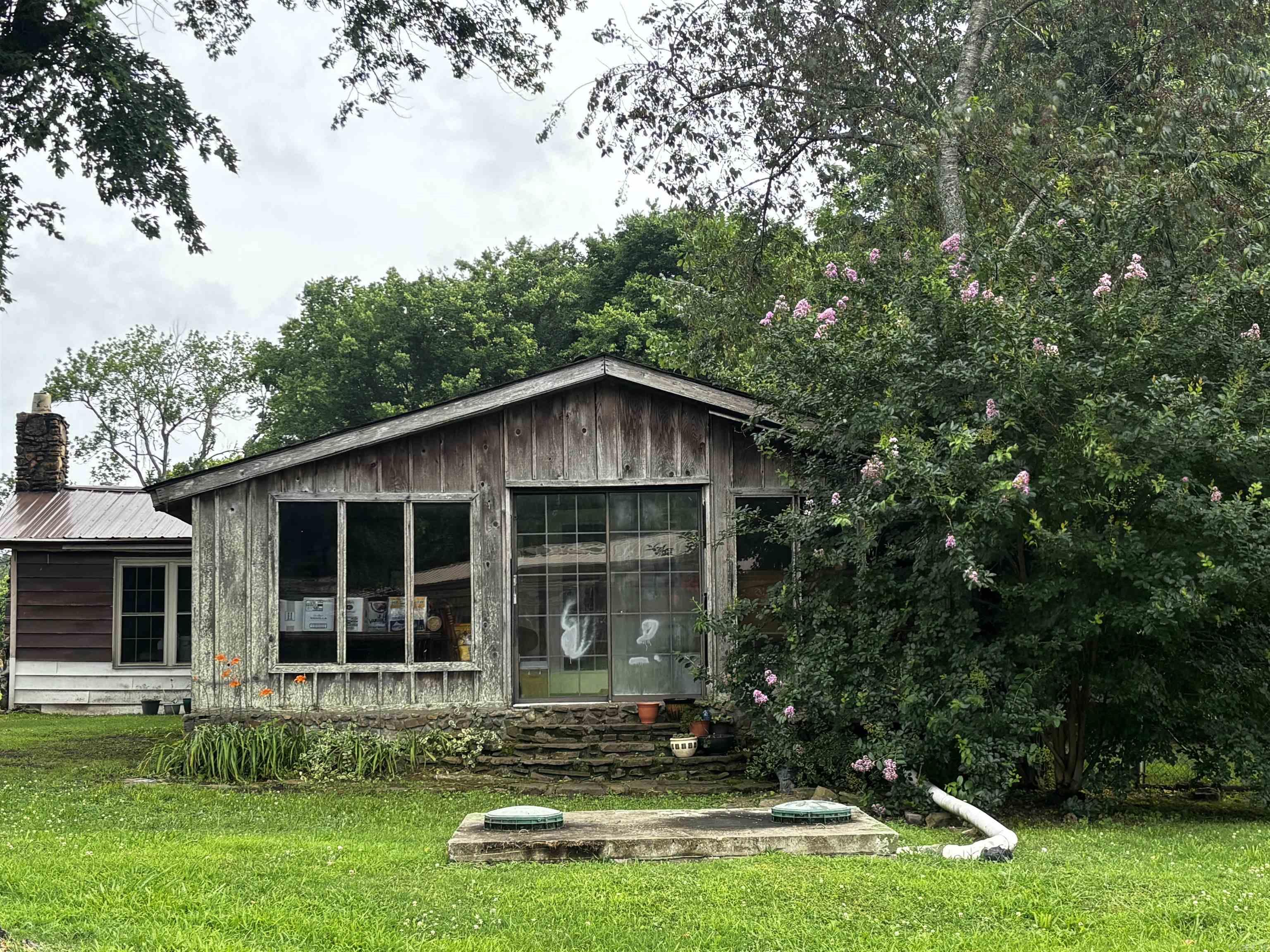 Opportunity awaits! Conveniently located just minutes from Overcup Lake, Morrilton and I-40, this property offers the perfect blend of country living and accessibility. Situated outside the city limits on approximately .60 acres, there's plenty of room to enjoy outdoor space while still being close to amenities. A metal roof installed just one year ago adds piece of mind. Whether you're looking for an investment property, a project to make your own, or a place to put down roots, this property offers plenty of potential and the chance to create something special. Agents see agent remarks.