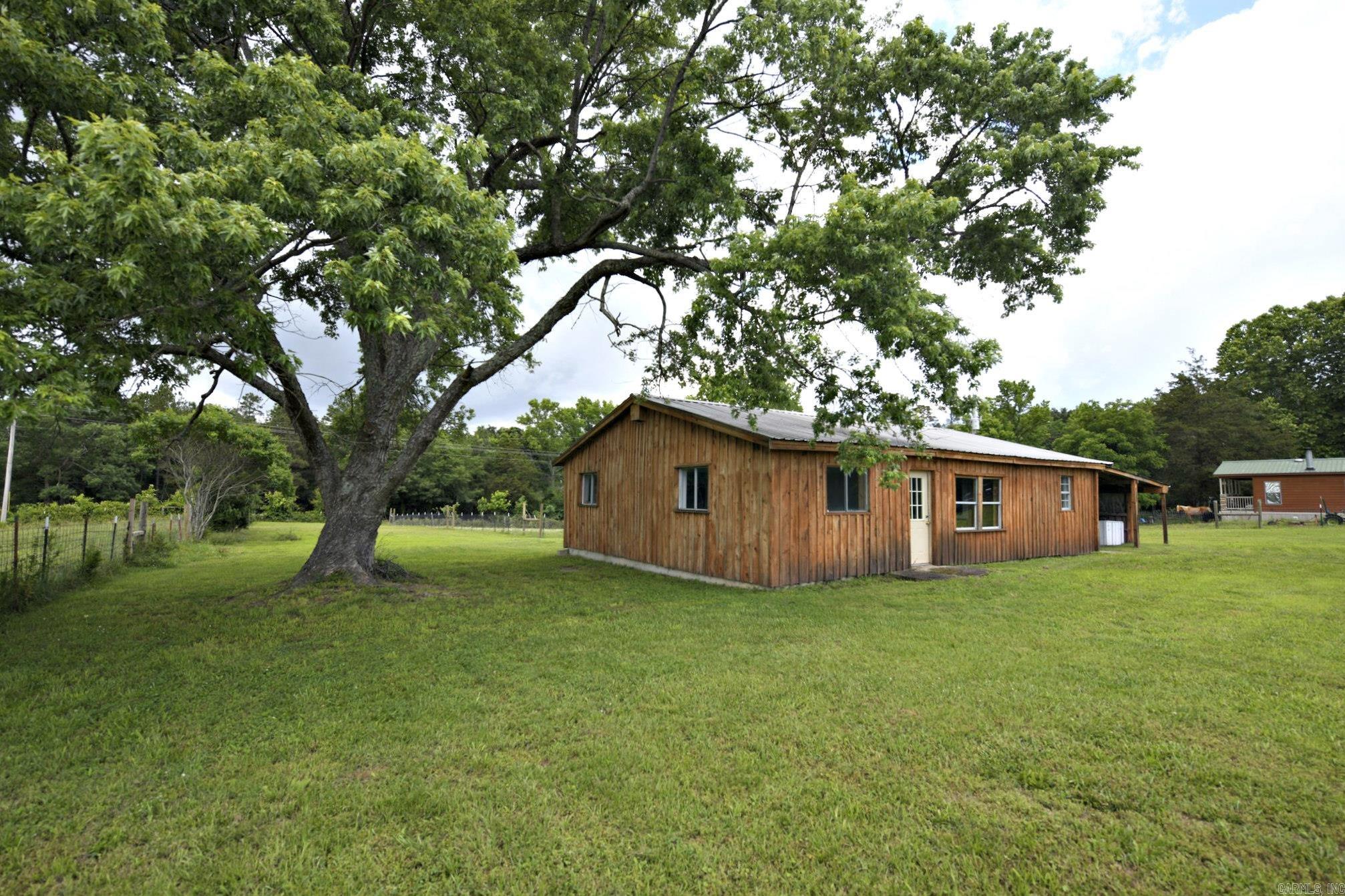 Looking for a cozy retreat with great potential? This 3-bedroom, 2-bathroom country cabin sits on 1.13 acres of fully fenced land, recently surveyed for accuracy. With some remodeling already completed, new siding, and a brand-new septic system, this home is well on its way to becoming the perfect getaway or investment property. The seller has made additional improvements, including the purchase of a 50-foot strip from the county road, providing direct access to the property. The existing easement road remains in place, offering flexibility for a future driveway. A new well has also been drilled on the property; while a pump has not yet been installed, buyers have the opportunity to complete it to suit their needs. While the home still needs some finishing touches, it offers plenty of opportunity to make it your own. Whether you're looking for a rental, a fixer-upper project, or your own quiet escape, this property is full of possibilities.
