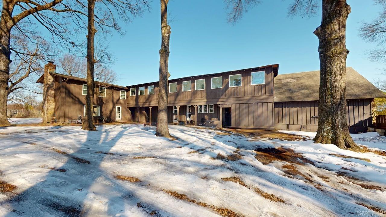 NEW HVAC FEB, 2026!! Over 6,100 sq ft of living space with 7 bedrooms, 6 full baths, and 2 half baths, including a primary suite on the main level. The flexible layout offers two full kitchens, two laundry rooms, multiple living areas, a great room, office/study, bonus room, and in-law quarters. Features include wood and tile flooring, walk-in closets and showers, a wood-burning fireplace. Enjoy large porches and outdoor living space. Level lot with ample parking. Currently being rented by the room for student housing. Lots of options to additional units. A unique property for investors, can be rented by the room or master lease.