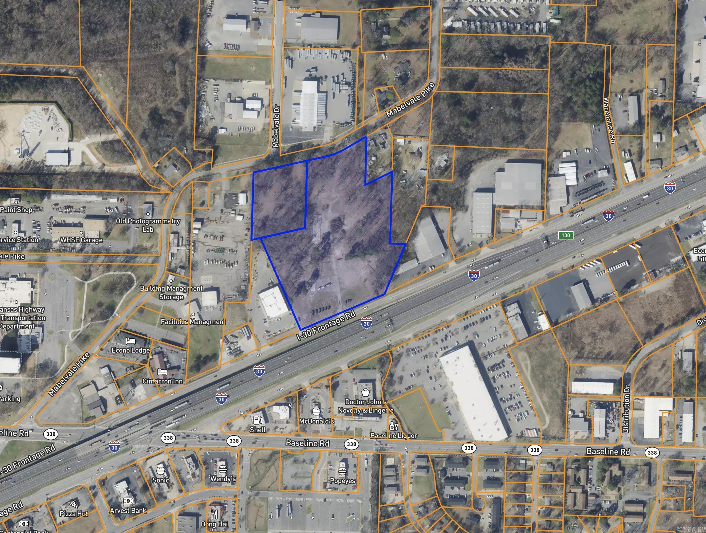 10000 I-30 & 8707 Mabelvale Pike!  Prime commercial development opportunity with approximately 13.3 acres located along the Interstate 30 frontage road. Zoned C-4 Open Display District, this property offers a wide range of permitted commercial uses including retail, office, office warehouse, hotels, restaurants, vehicle sales and service, equipment rental, mini-storage, building material sales, and other commercial developments.  The C-4 zoning classification is specifically designed for businesses serving the motoring public and allows for certain outdoor display and storage uses, making it ideal for automotive, contractor, equipment, landscape, and retail-related operations. With excellent interstate visibility, convenient access, and substantial development potential, this property is well-positioned for investors, developers, and owner-users seeking a high-traffic commercial location.