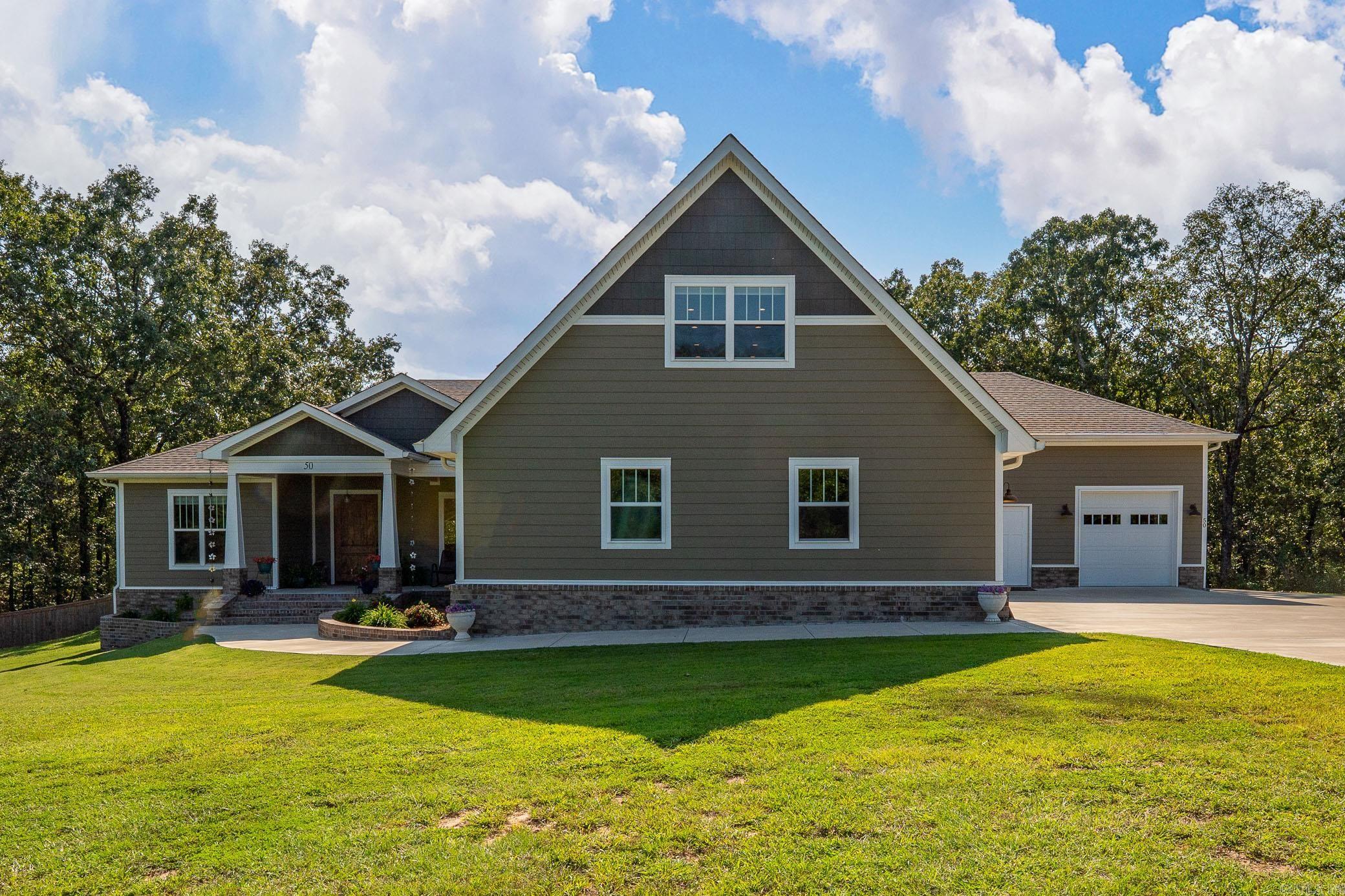 Beautiful 4-bedroom, 3.5-bath home with two bonus rooms plus unique extras, all on 5 private acres inside the gated Stone Hill Ranch subdivision. The inviting front porch leads you into a spacious foyer with a formal dining room. The large living room opens to the gourmet kitchen, complete with granite countertops, gorgeous backsplash, stainless steel appliances, double ovens, huge walk-in custom pantry & generous center island w/breakfast area. The primary suite is truly a retreat w/dual vanities, soaking tub, tiled walk-in shower & two large walk-in closets. There are two additional guest rooms on the main level that share a hall bath and a half bath, laundry room & mudroom. Upstairs offers a spacious fourth bedroom, full hall bath & oversized bonus room. Additional spaces include a 331 sq. ft. flex room w/ 1/2 bath attached to the garage, plus heated & cooled utility/pet room w/backyard access & 4 car garage. Outside enjoy a fenced yard area, patio & great views of the beautiful surroundings.