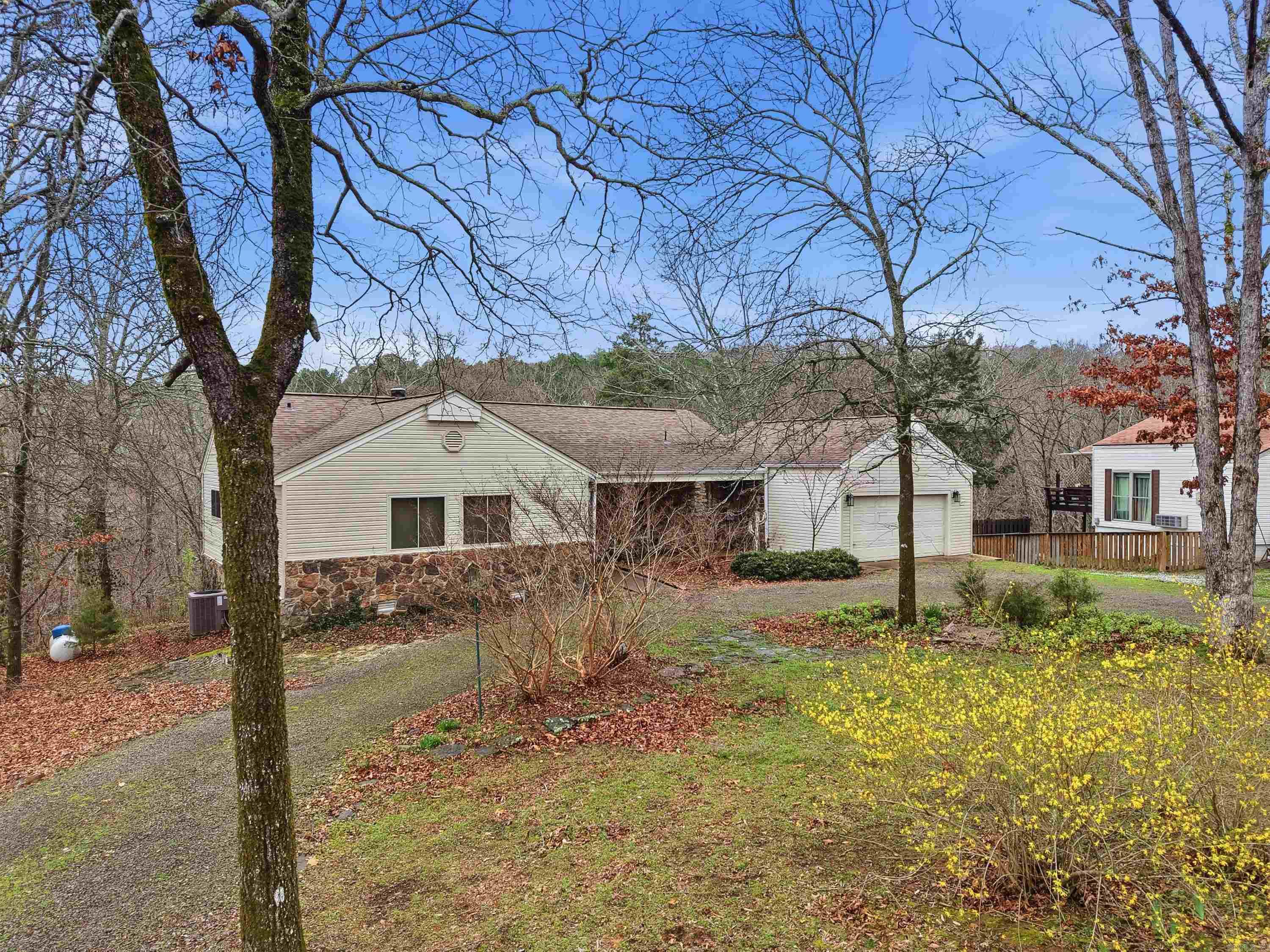 Discover comfort, style, & peaceful surroundings in this beautifully updated home located across Indian Hills Golf Course. Thoughtfully refreshed with new paint, new appliances, quartz countertops, & luxury vinyl flooring, this home blends modern updates with warm, inviting charm. The open kitchen & living area create the perfect gathering space, highlighted by a stunning stone fireplace & natural light that flows throughout the home. Beautifully updated bathrooms add a fresh, modern feel while maintaining comfort & functionality. Step outside onto the spacious covered back porch, an ideal place to relax with morning coffee or unwind in the evening while listening to the tranquil creek flowing. The lower level offers incredible flexibility, making it perfect for guests, children, or a private retreat for family & friends. Perfectly situated just minutes from Circle Acres Boat Launch, this home offers easy access to lake days, outdoor adventures, & the relaxed lifestyle that makes this area so special. This is more than a home — it’s a place to slow down, gather, & enjoy everything the surrounding area has to offer. 2005 Sylvan boat for sale with slip conveying at FFB Marina $13,900