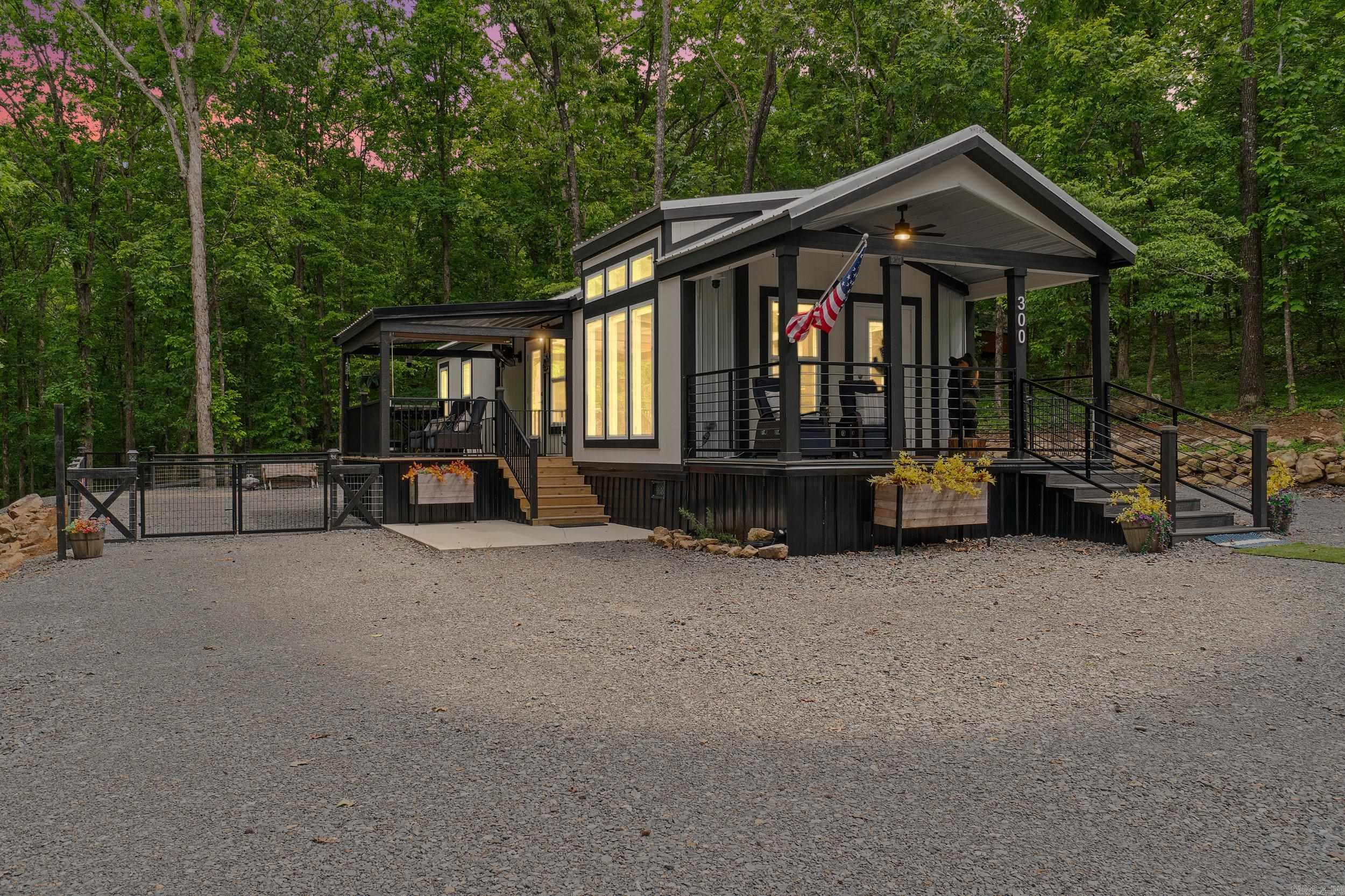 Discover your perfect retreat in this immaculate 1-bedroom, 1-bathroom home,  & large shop newly built, nestled just a stone’s throw from the shores of Greers Ferry Lake. Situated near Sugarloaf Park ?& the Van Buren County line, this property combines the serene charm of lakeside living with convenient access to local amenities.? As you step inside, you’ll be greeted by a thoughtfully designed open floor plan that maximizes space ?& natural light. The modern kitchen boasts sleek countertops ?& space, perfect for culinary enthusiasts. The cozy living area invites you to unwind, while the spacious bedroom offers a peaceful sanctuary, complete with ample storage ?& easy access to the elegantly appointed bathroom.? This home is not just about beauty; it’s about functionality. With features like energy-efficient windows ?& a laundry area, every detail has been meticulously considered to enhance your living experience.? Step outside to enjoy the lush? wooded surroundings ?& fresh air. Spend your days exploring the nearby hiking trails?, playing in the fresh waters of Greers Ferry Lake, or take a short drive to the charming town of Greers Ferry for shopping & dining.