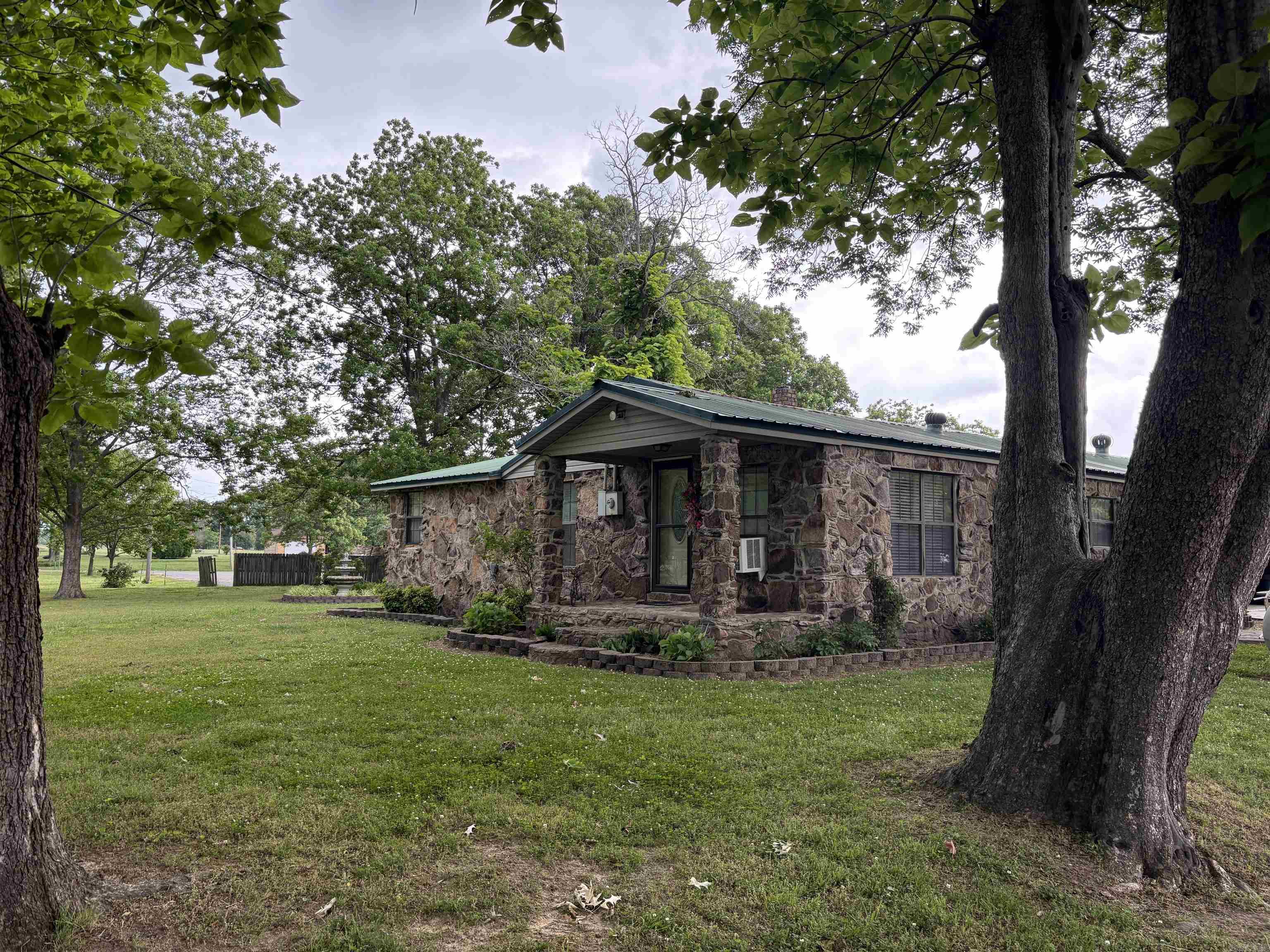 Possibilities like this on the White River are rare. Located near Possum Grape/Bradford, this unique 3-acre property sits immediately beside a heavily used Arkansas Game & Fish boat launch, making it an incredible setup for duck hunters, fishermen, outdoorsmen, large families, or investor groups seeking the ultimate hunting and fishing retreat.  The property includes a 3 bedroom, 2 bath home plus an additional house used for storage, offering excellent potential for a hunting lodge, duck camp, fishing getaway, Airbnb, or weekend retreat. With room to comfortably accommodate large groups, there is ample space for boats, ATVs, side-by-sides, trailers, campers, and outdoor entertaining.  A standout feature is the exceptionally cool basement/root cellar/storm shelter, ideal for storage and protection year-round. Countless outdoorsmen use this area each season to access some of Arkansas’s best duck hunting and fishing waters. Rare opportunity to own a true White River sportsman’s property with location, utility, and recreational appeal that is difficult to duplicate. <Public boat launch access literally next door!!!>