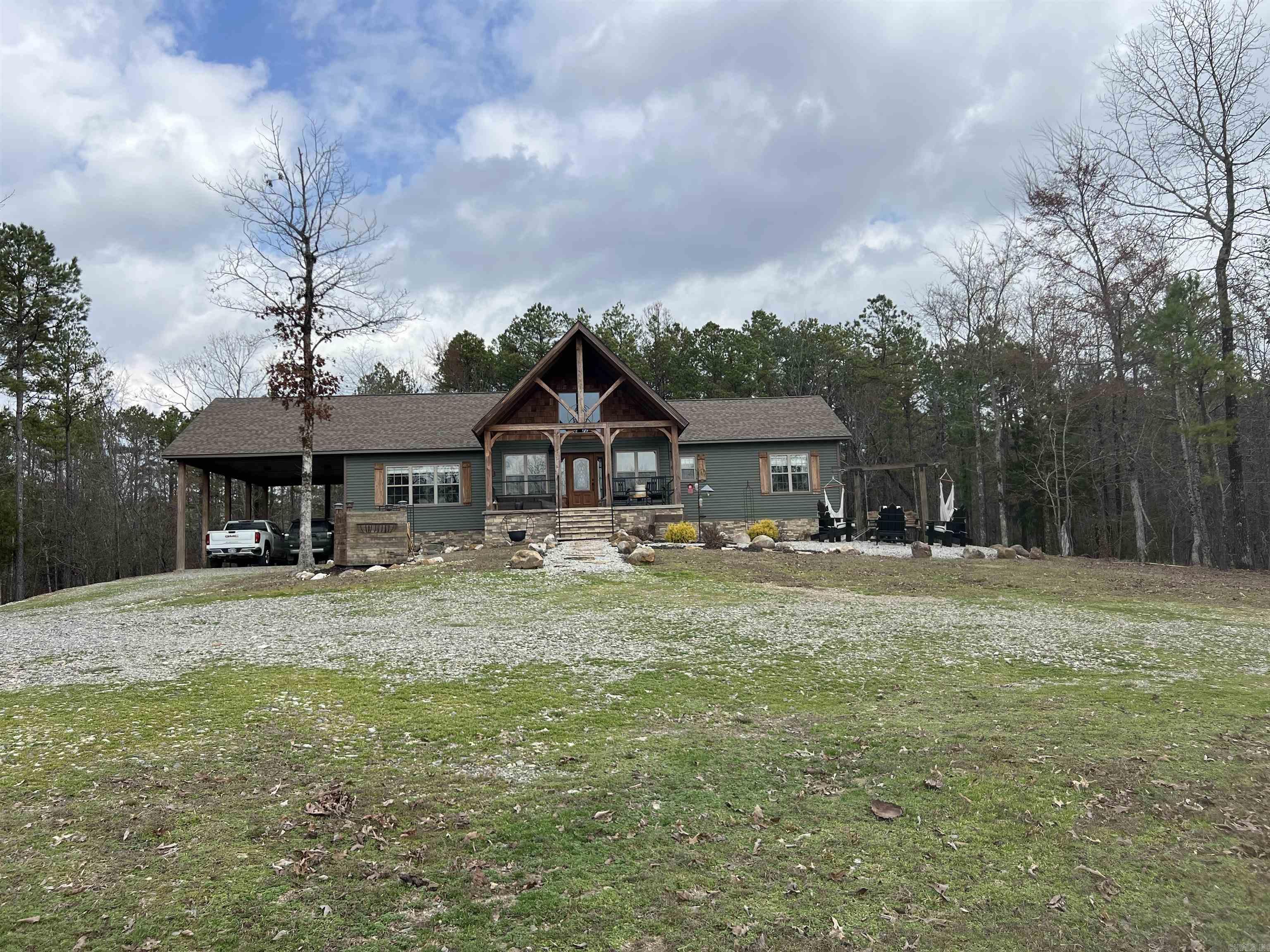 Custom-Built Showstopper on 6.23 Acres Near Lake Ouachita This stunning three-bedroom, two-bath home blends luxury craftsmanship with peaceful country living. Inside, soaring tongue-and-groove vaulted ceilings and a cozy gas log fireplace create a warm, inviting atmosphere. Every detail is thoughtfully finished, from the premium doors and windows to the custom-built countertops. The spa-inspired primary suite features an enormous walk-in shower and a giant walk-in closet, while the kitchen boasts a large walk-in pantry designed for serious storage. Outdoors, you’ll find a  whole house generator that will provide comfort and convenience with a power outage, a 31x40 shop with two roll-up doors and a 20x40 lean-to — perfect for projects, equipment, or toys. The 6.23-acre property is alive with wildlife and offers breathtaking, serene views, just minutes from beautiful Lake Ouachita. This home isn’t just a place to live, it’s a retreat you’ll never want to leave.
