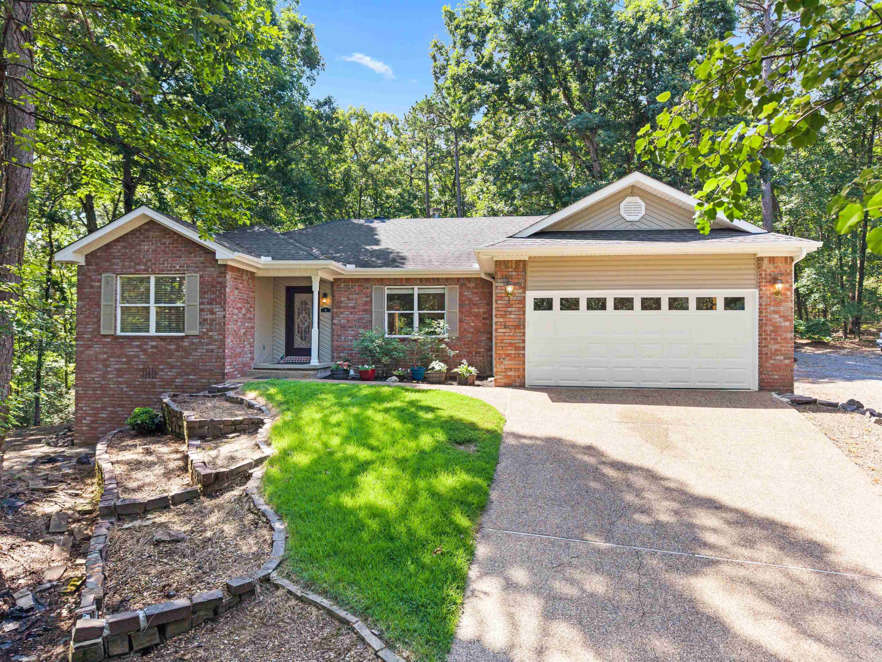 Remodeled GEM on 3/4 Acre Triple Lot near Lake Pineda! What a great remodeled 3Bed/2Bath home with Entertainment-sized Deck and Fencing for furry friends! Freshly painted throughout with bright white baseboards that pop! Enjoy the See-through Gas Fireplace between the Living Room and Dining/Sitting Room, or cook up a storm on the Gas Range in the Oversized Kitchen! The Master Bathroom boasts an Upscale Dual Vanity, and His/Hers Walk-in Closets! Separate Laundry Room, Walk-in Storage under the house, Backyard Shed, and 2 Car Garage + Overflow parking area on lot next door! Roof replaced in 2018 and has been checked and certified recently!  SEE THE ATTACHED VIRTUAL TOUR! 26,000 acre gated Hot Springs Village offers 11 Lakes & 9 Golf Courses, a Fitness Center, Pickleball, 2 Pools, 2 Marinas, 20+ Miles of Walking Trails, and much more!
