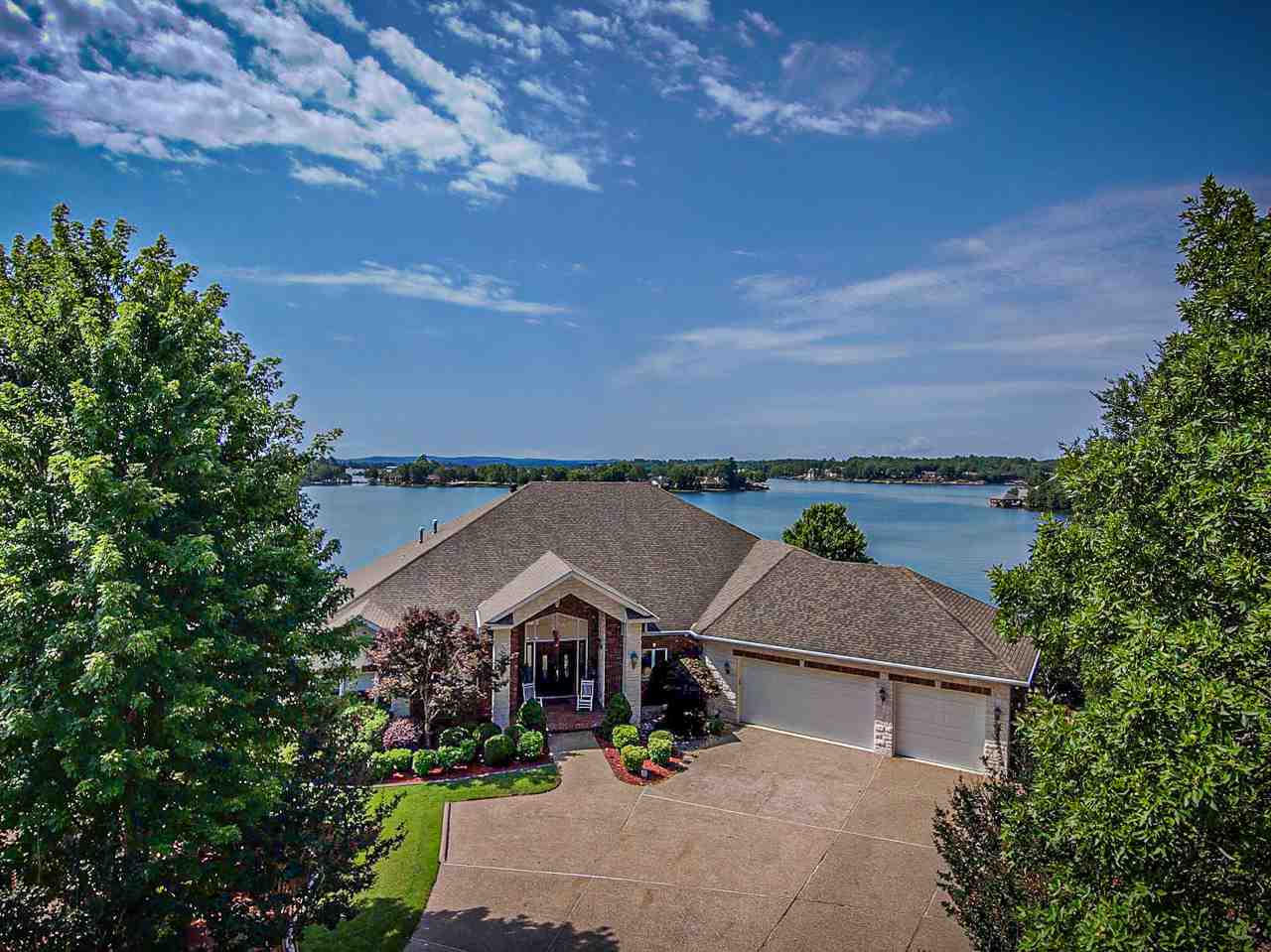 Lake Balboa stunner in this custom lakefront home w/perfect view on a point lot.  Built for the discriminating buyer w/an appreciation for quality, opulence & Grandeur. Chefs kitchen has EVERYTHING for entertaining or casual dining - Lots of custom cabinetry, granite, ice maker, 3 sinks, double ovens & double island - plus the lake view.Everything for life is on entry level.The lower level is another grand living space w/full kitchen, gathering room w/fireplace, 2 baths & 4 bedrooms. MUST SEE TO APPRECIATE!