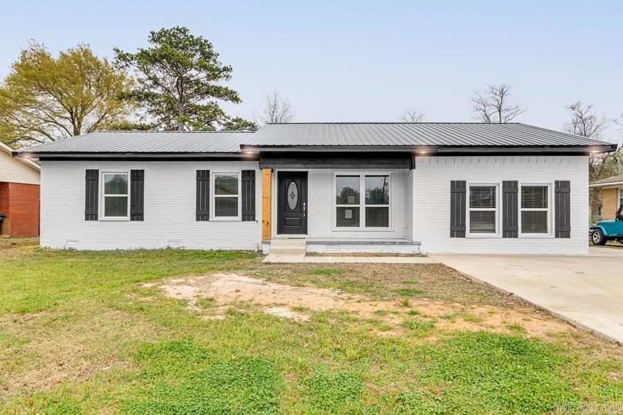 What an incredible find in Walnut Ridge! This gorgeous home has undergone an extensive remodel - essentially brand new! New stainless steel appliances including a new fridge, all new kitchen, new granite, all new bathrooms, all new electric HVAC, new metal roof, new flooring, new washer and dryer, new hot water heater, and new blinds. Modern open floor plan and design. This beautiful masterpiece is completely ready to move in - all you need is your furniture! You have 4 bedrooms and 3 full baths - loads of amenities to supply your family or friends! Three walk-in closets throughout the home provides great storage space. The master suite features a walk-in closet, a vanity with granite counter top, and large walk-in shower with high-end tile and a glass door, and access to the backyard deck. You'll be proud to show off your new spacious kitchen that features an abundance of counter space with granite tops, large stainless kitchen sink, stainless steel appliances, five burner gas range with griddle, and an island with a stainless prep sink. Enjoy time with friends and family on you extra large backyard deck! Have peace of mind with a new long lasting metal roof. Call today!