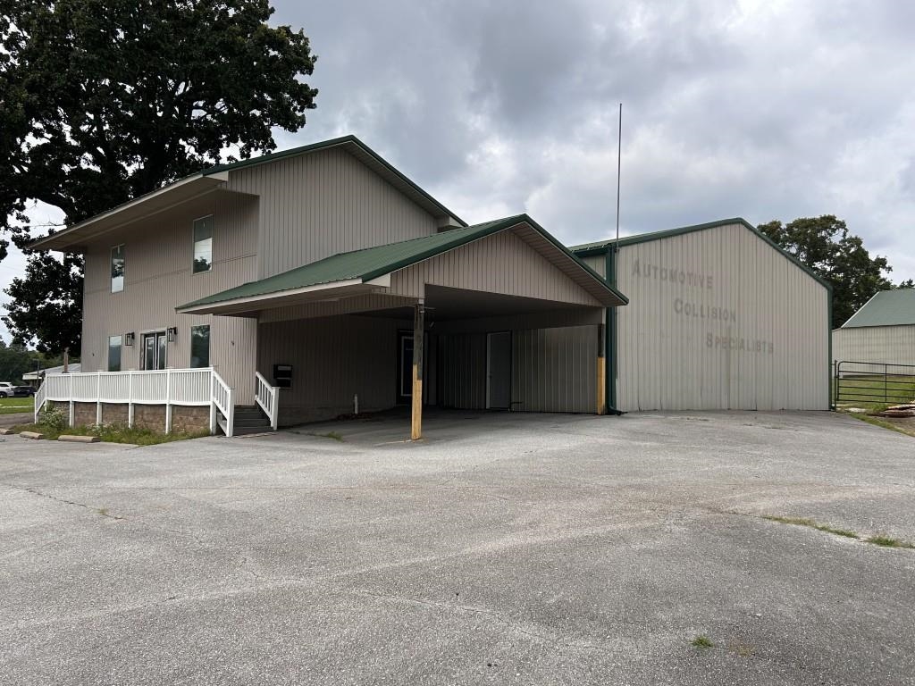 Prime Commercial Opportunity on West Main Street in Mountain View, Arkansas! Situated on 1.63 acres with excellent visibility and easy access, this versatile property offers over 10,000 square feet in two separate buildings, providing endless possibilities for business or investment.  The front building has served as office space and features multiple entrances, making it ideal for professional offices, retail, service businesses, or mixed-use applications. Its flexible layout can easily be converted into a customer-friendly storefront with outstanding exposure along one of the area's busiest corridors.  The rear building, formerly an auto collision repair facility, offers expansive workspace suited for automotive services, manufacturing, warehousing, contractor operations, equipment storage, or other commercial uses. A second section of approximately 4,000 square feet is currently utilized for vehicle repair and provides additional open-concept space for a variety of industrial or specialty businesses.  Whether you're expanding, relocating, or investing, this high-visibility property offers the space, flexibility, and location to help your business succeed. Offered at $525,000.