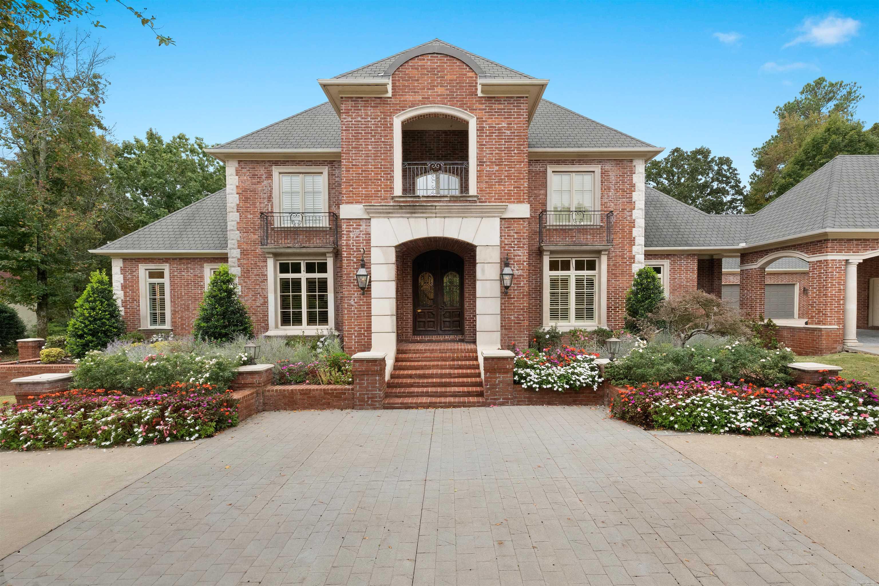 Stunning Chenal home is ideally located on the 15th fairway of Chenal Golf Course & has undergone an extensive high-end remodel designed to enhance comfort, functionality, and long-term value. Offering 4 beds, 4 full baths plus 2 half baths, the home features multiple living & entertaining areas. The grand foyer opens to the formal dining room, updated bar area & formal living room. The chef’s kitchen has been beautifully enhanced with new countertops, sinks, fixtures, two dishwashers, & ice machine, which flows seamlessly into the spacious family room with abundant natural light, coffered ceilings & a site-built fireplace. The primary suite is a private retreat w/ a fireplace & a custom remodeled spa-inspired bath featuring new cabinetry, double shower, soaking tub, heated floors, Toto toilet, refined lighting & distinctive Egyptian wood accents, plus a custom-designed closet w/ upgraded lighting. Main level also includes a guest suite, redesigned study & workout room. Upstairs offers two beds, two full baths, a game room & media room. Enjoy outdoor living on the covered porch overlooking a park-like backyard with inground pool, hot tub, and golf course view. See List of Updates!
