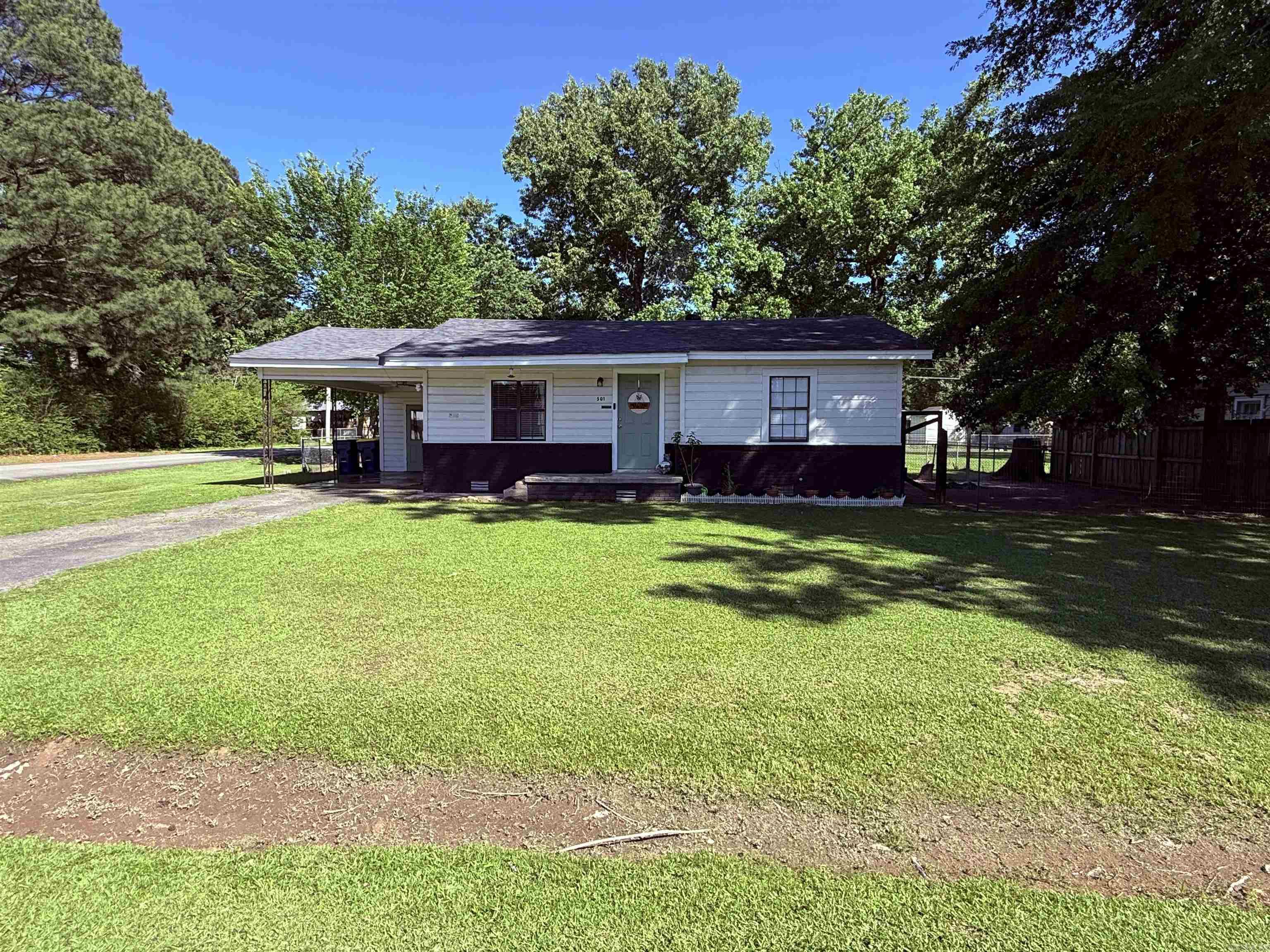 Welcome to 501 S. Grant Street in Cabot! This 2 bedroom, 1 bathroom home is a great opportunity for buyers looking for an affordable home in a convenient location. Sitting on a nice-sized lot, this property offers a spacious fenced backyard, covered carport, outdoor fire pit area, and convenient storage located right across the street. Inside, you’ll find a simple, functional layout with a cozy living area and plenty of potential to make it your own. Located in Cabot Public Schools and just minutes from shopping, dining, parks, and everyday conveniences, this home is a smart option for a first-time buyer, downsizer, or anyone looking for a place to call home in Cabot. Schedule your showing and come see the potential this Cabot home has to offer! Agents see remarks