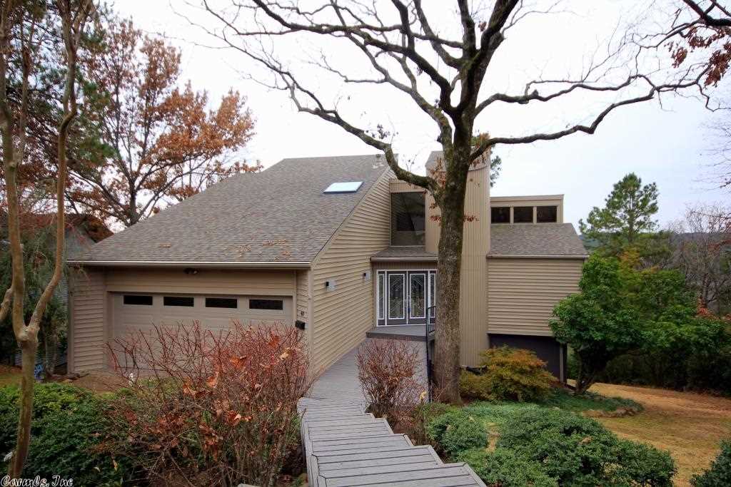 Spectacular Contemporary in Fabulous move in condition!  Glass walls w/ amazing views. Open flr plan w/ two story vaulted ceilings in dining/living area along w/ fireplace and access to outdoor covered terrace.  Updated kitchen with new quality appliances and custom cabinets.  Open Loft master suite w/ scenic windows and new bath.  Lower level- sep. family living with access to lower terrace and two addit. bedrms with full bath.  Outstanding outdoor entertaining w/in-ground pool and pool house! 2 car gar.