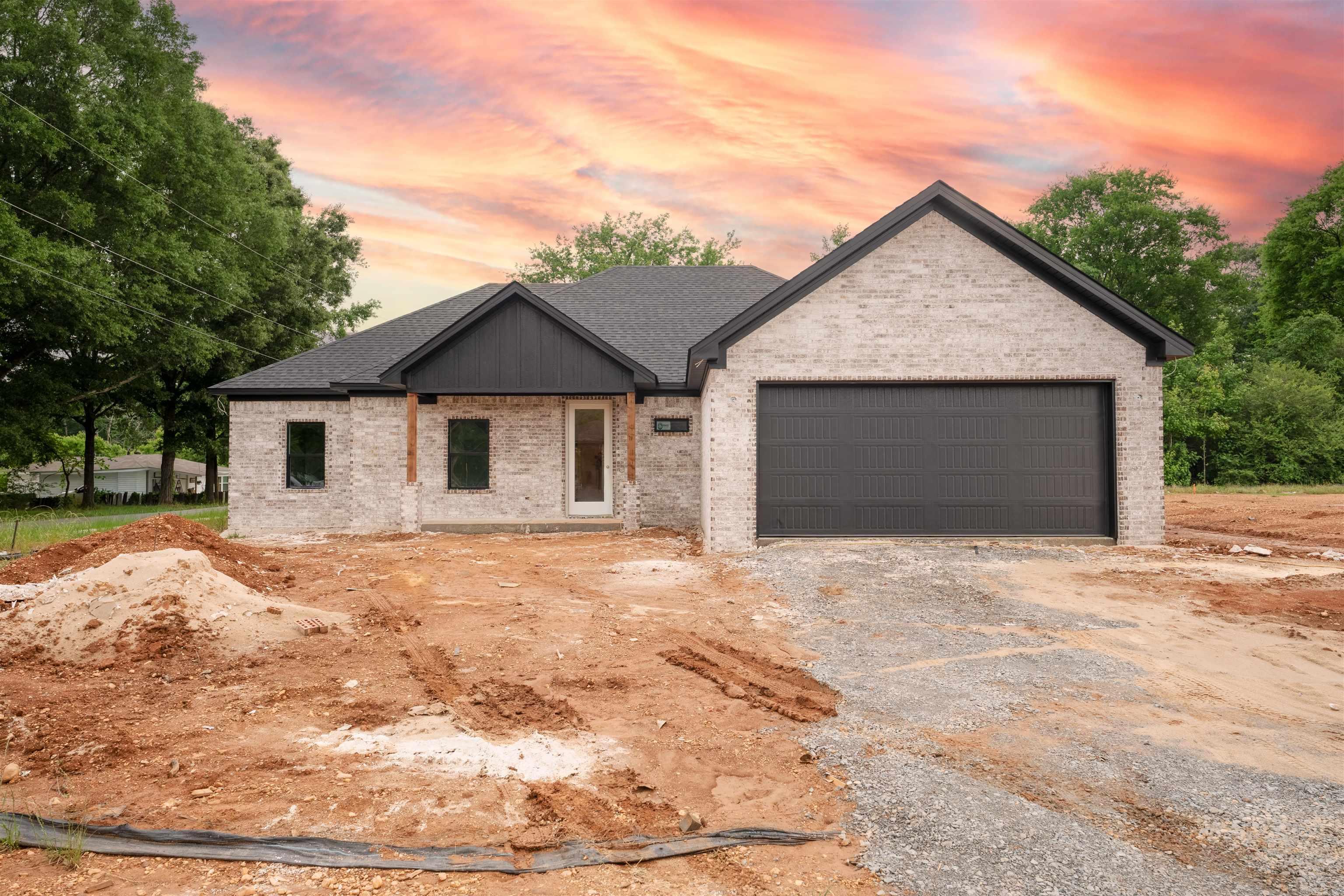 Welcome to 203 Apollo Way in Haskell, Arkansas! Currently under construction, this beautiful 4-bedroom, 2-bath home offers 1,785 square feet of thoughtfully designed living space with all the features today's buyers are looking for.  Step inside to discover durable luxury vinyl plank flooring throughout, stunning countertops, and an open-concept layout that provides space in all the right places. The spacious living room is anchored by a cozy fireplace, creating the perfect gathering spot for family and friends.  The kitchen is designed for both function and style, featuring gas appliances and a large walk-in pantry with abundant shelving and storage space. The primary suite is sure to impress with an oversized bathroom and a walk-in closet rarely found in homes of this size.  Situated on a nice-sized lot, the home also offers a large covered back patio that's perfect for entertaining, grilling, or simply relaxing outdoors.  Don't miss your opportunity to own this brand-new home in a growing community—schedule your showing today!