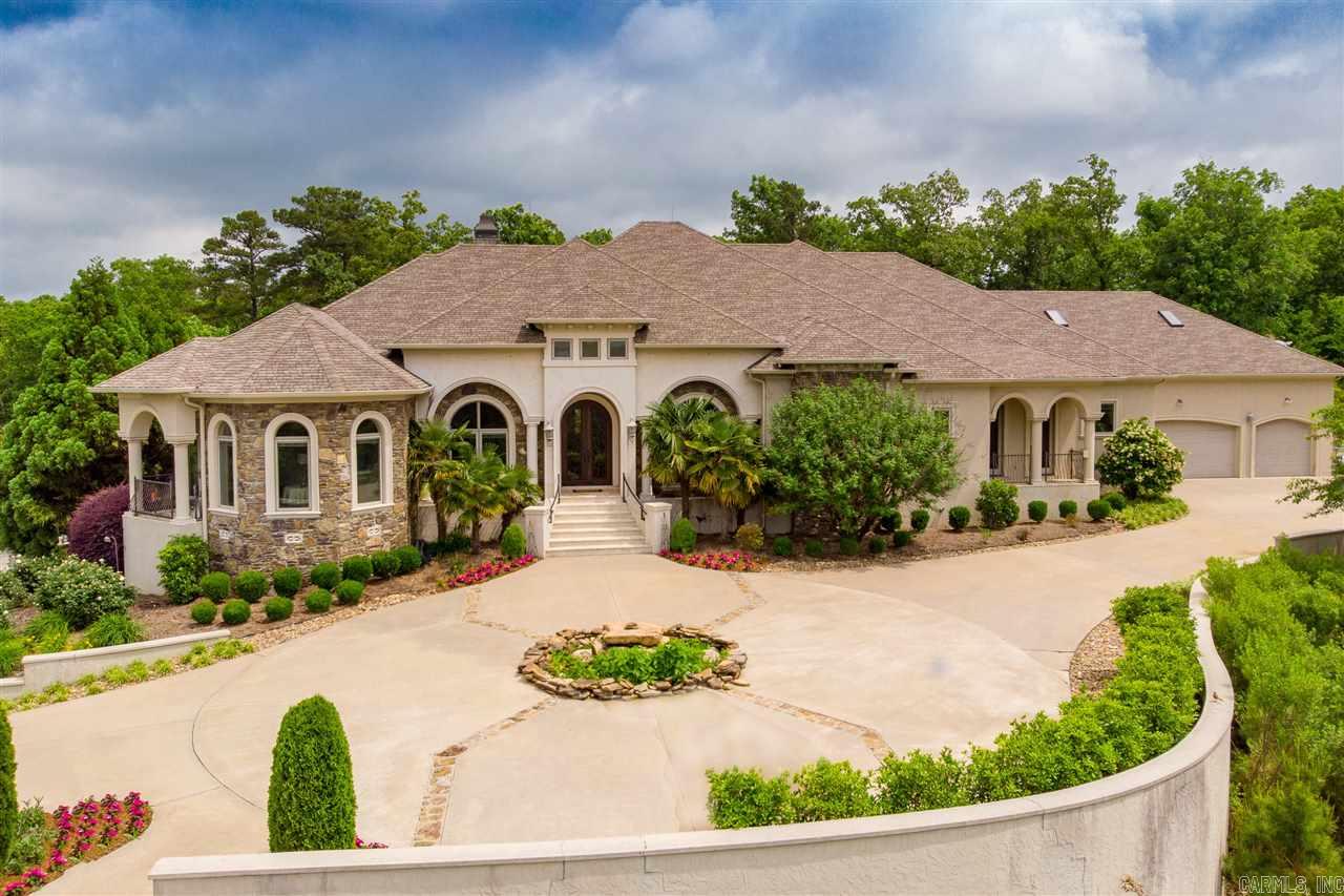 Stunning Hilltop Estate on approx. 13.75 acres. Beautiful one level custom built home with every amenity. Handsome architecture and impeccable quality. Fabulous private setting minutes from Chenal. The ultimate floor plan for family living and entertaining. Open living, formal dining, gourmet kitchen with breakfast, Luxurious spa inspired master suite with private veranda.  Exquisite outdoor living with covered terrace and sparkling free form pool.  Additional 516 sf game/media room.  3 car garage.  Gated.