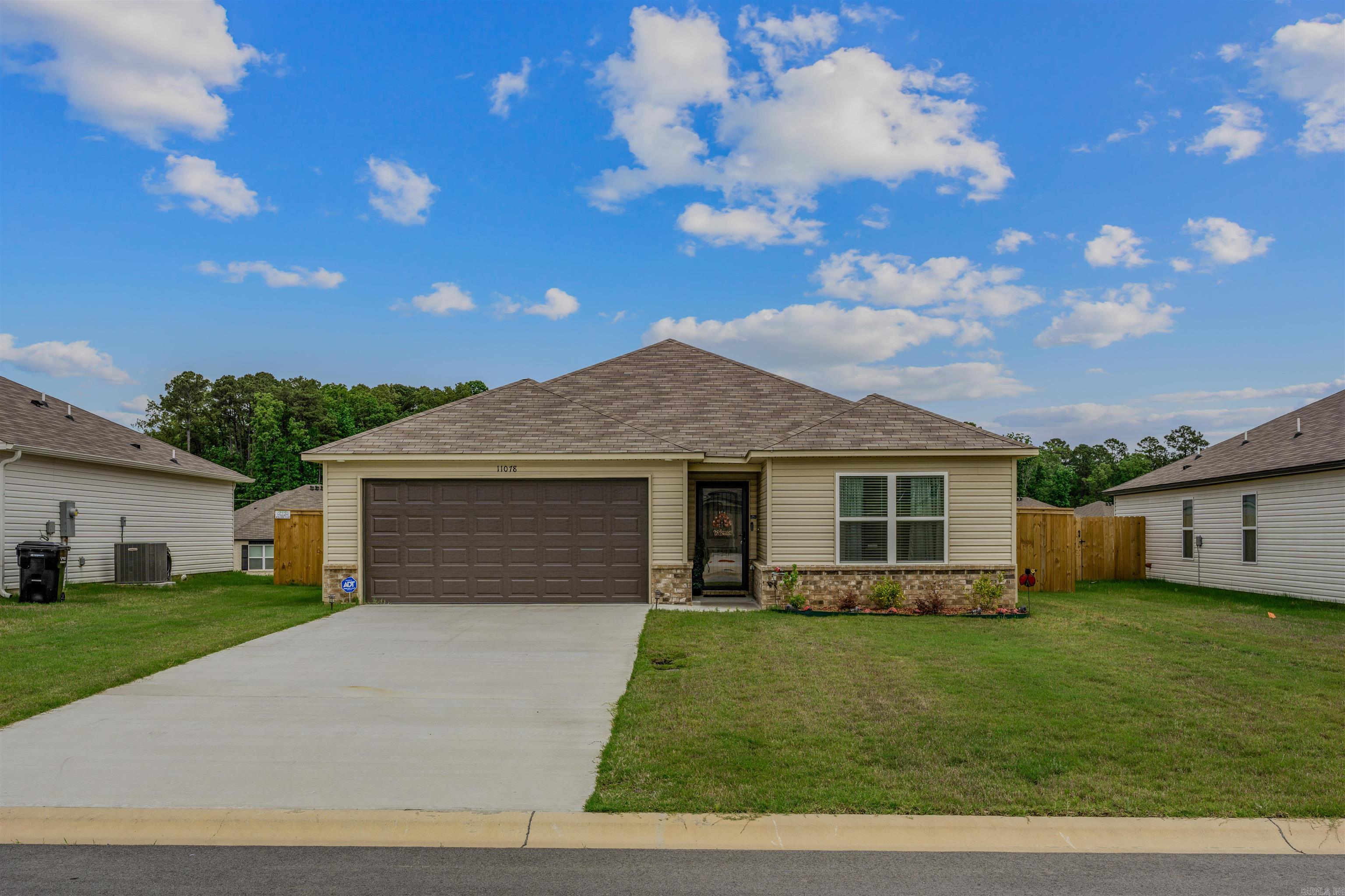 Beautiful 3-bed 2-bath home built in 2025 in the new Springlake Trails subdivision. Newer construction home sits on a level lot with a beautiful lawn, a fully fenced-in back yard, and plenty of room to entertain. As you walk into the front door, you're greeted with beautiful luxury plank floors. Walk down the entryway where it opens up to be greeted by a modern kitchen and great room. The kitchen is equipped with all stainless steel appliances, a breakfast bar, and plenty of storage. The master suite is spacious, featuring his and her closets, a beautiful master bath area, and plenty of storage. The laundry room has plenty of space and is conveniently located near the garage. In the backyard, there is a storage building to neatly store your lawn equipment or other items. This is a must see!