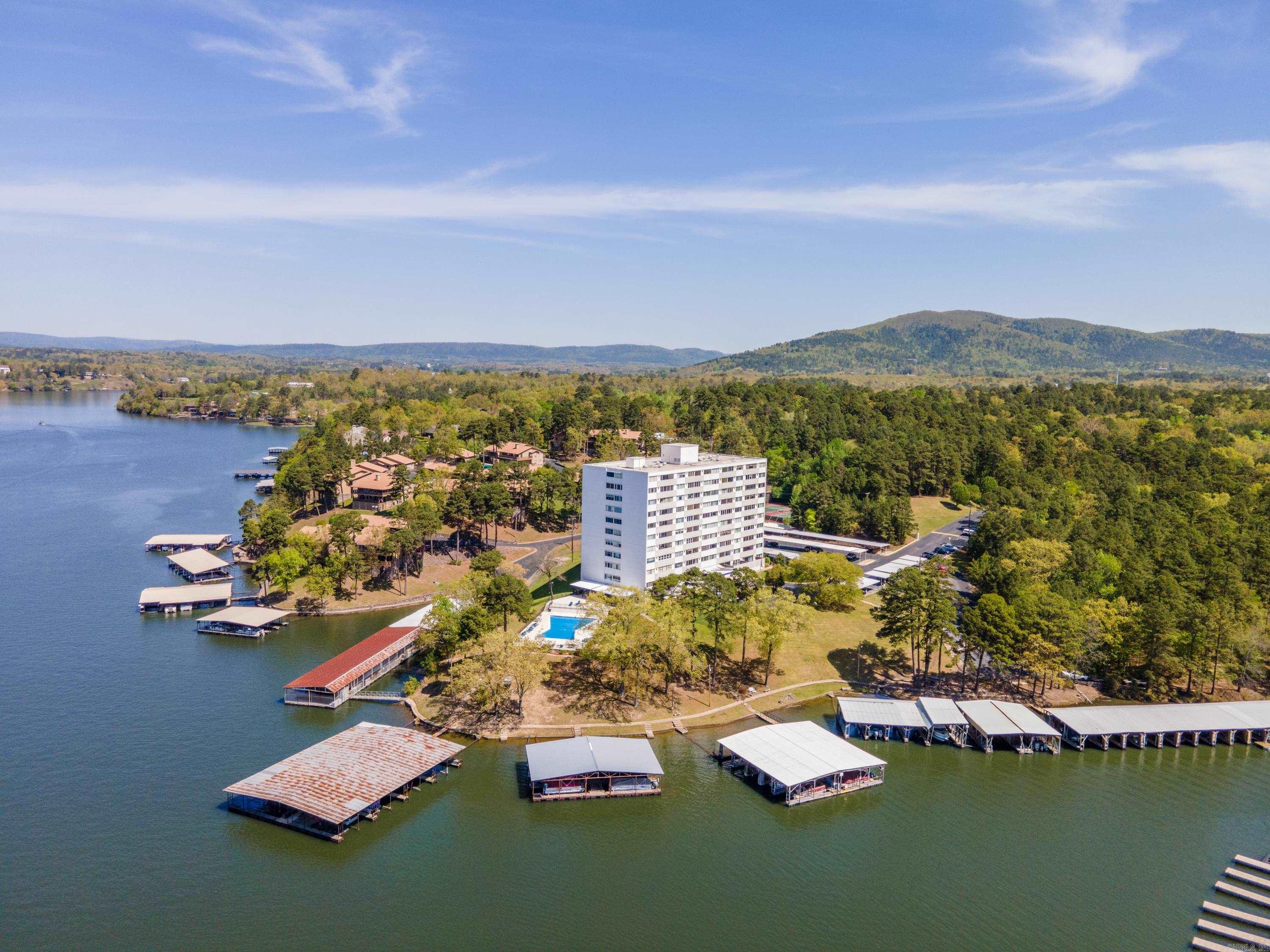 INVESTORS TAKE NOTICE - Beautifully updated, FULLY FURNISHED, move in ready Lake Hamilton 2 bedroom 2 bath condo perfect for short-term vacation rentals or weekend retreat. BOAT SLIP INCLUDED. Relax in this 1,178 sq ft condo including refrigerator, washer and dryer and all furnishings making this property turn-key. Convenient Airport Road location close to everything. Complex features gated entrance, swimming pool, tennis courts, covered patio area, pool table, tennis court, outdoor grills, manager's office, family room & so much more. Includes 1 covered parking space.