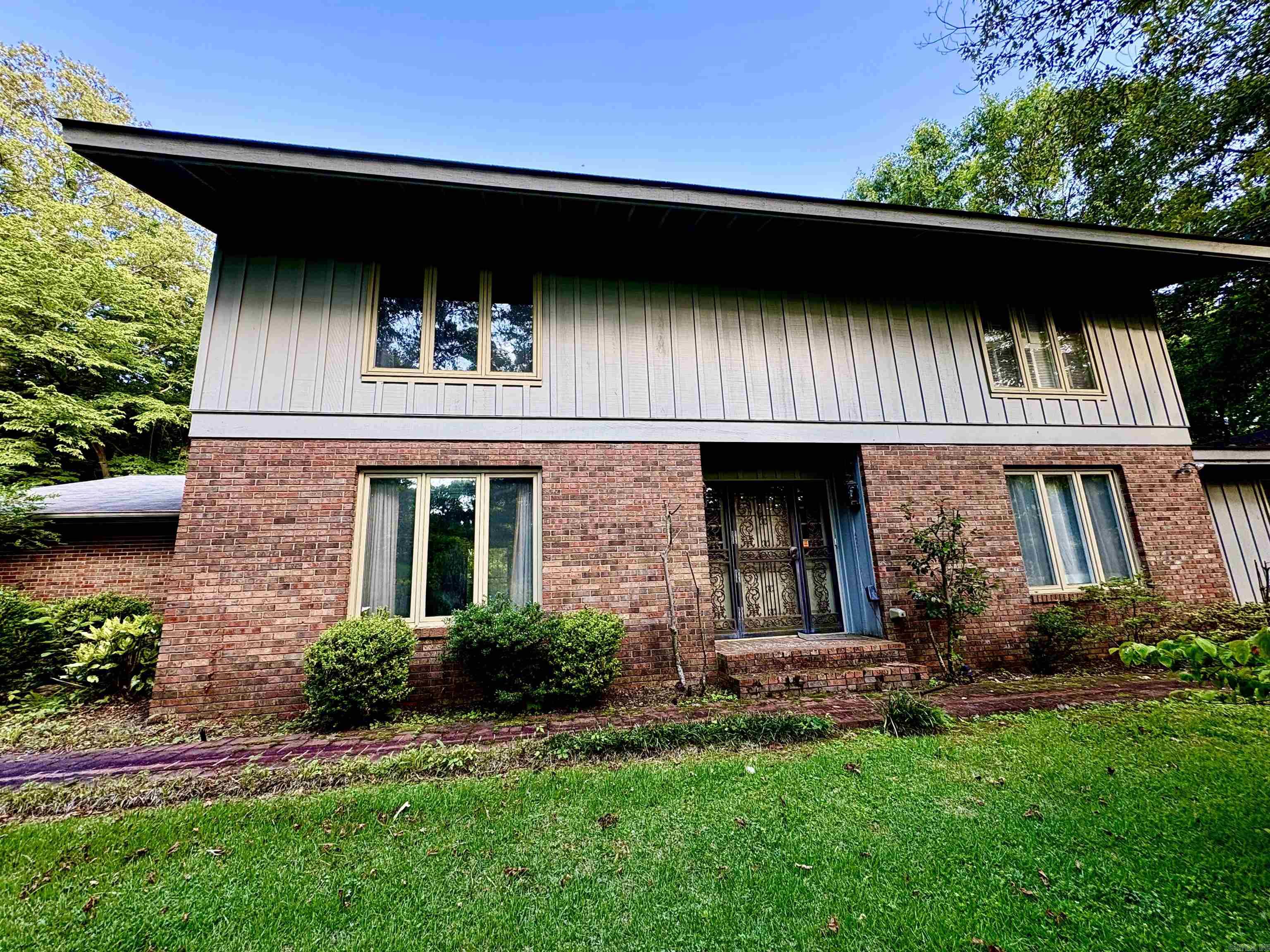 Perched upon a hill and full of potential, this unique two-story home offers an outstanding investment opportunity on 2.6 beautiful acres. Inside, you’ll find timeless character with stunning cypress walls and classic brick floors that create warmth and charm throughout the home. The spacious layout features a large addition, including a generous primary suite complete with a private en suite bathroom for added comfort and convenience. The property offers plenty of room to enjoy country living while still providing endless possibilities for customization and updates. For those seeking even more space, an additional 9 acres with a beautiful playhouse/ reading nook located directly behind the home are available for purchase making this an exceptional opportunity to expand your investment or create your own private retreat.