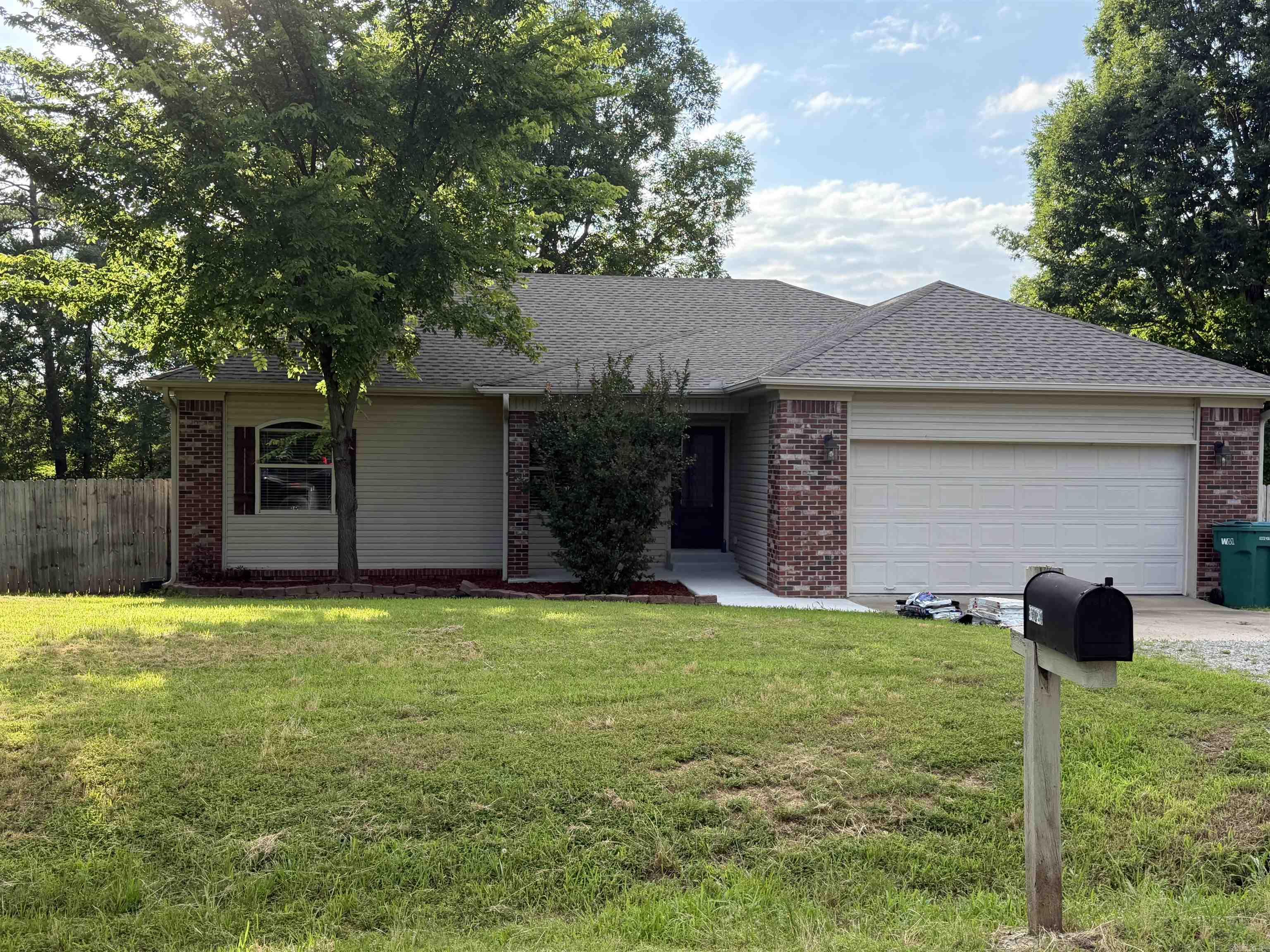 Grest 3 bed 2 bath starter home on a spacious corner lot- almost an acre. Features a brand new roof, and frig will stay. Bryant schools. A perfect place to start your new homeownership!