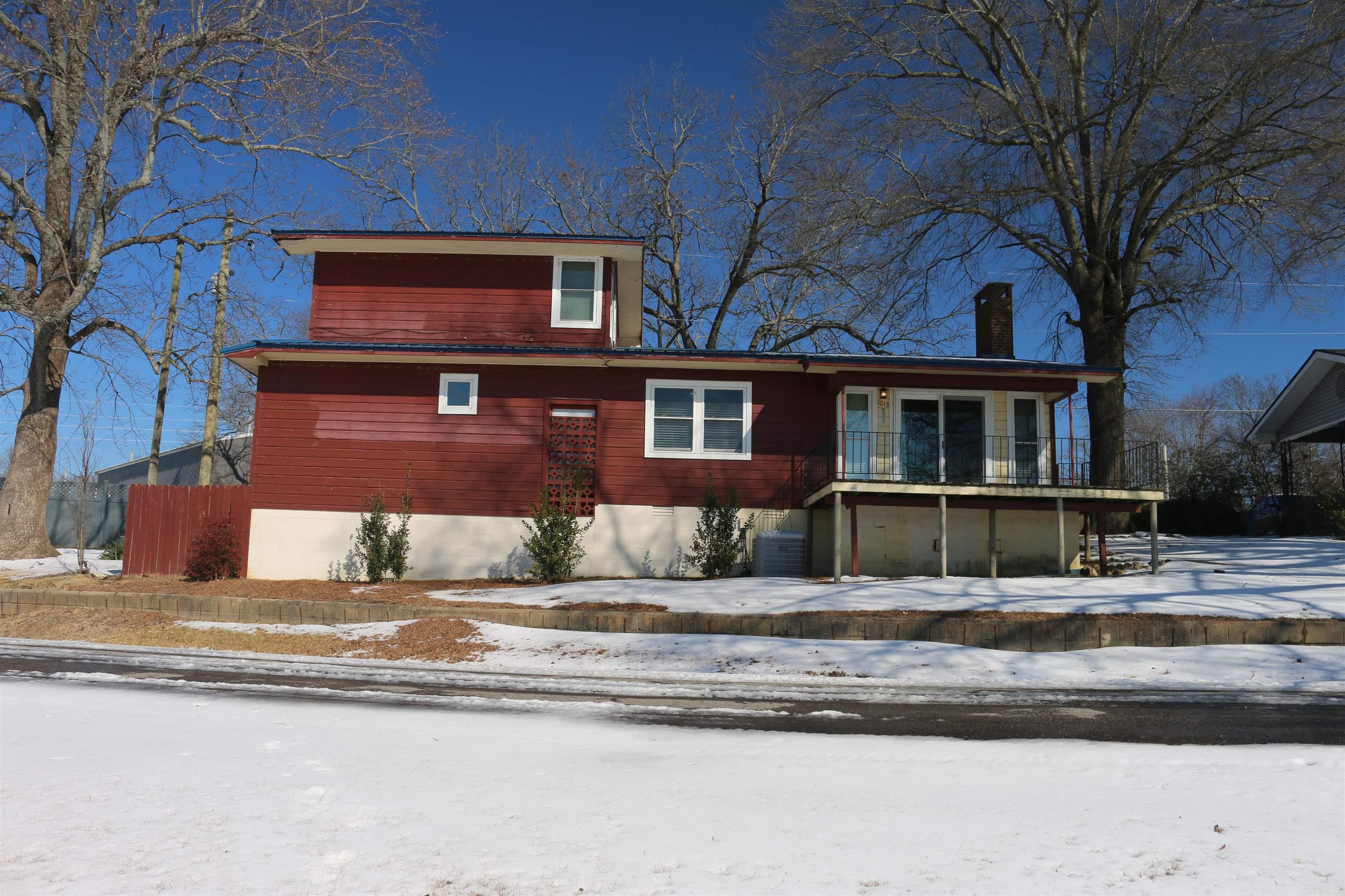 Own your own split-level home with lakefront living in Mena, Arkansas! This 2-bed 2-bath split-level home has open vaulted ceilings with exposed beams, making for a peaceful and relaxing setting in the living/kitchen area. With .26 acres and a deeded easement for lake access, you can relax on or by the water in the warmer months and enjoy some kayaking and fishing. With a deck built off the house overlooking the lake you can enjoy soaking up the serenity. This 2-bed 2-bath home has an office room that could be converted to a storage or baby room as well. The hardwood flooring throughout the home sets the tone. The home is set with a brick fireplace that is gas-operated as well. Central heat and air are established in the home for comfort and ease. With a new metal roof, foundation securing, new plumbing, and all new windows set in place within the last 6 years. Located near the new Mena bike trails, this is your chance to own a slice of lakeside paradise and still be close to all amenities. Reach out for your private showing of this opportunity.
