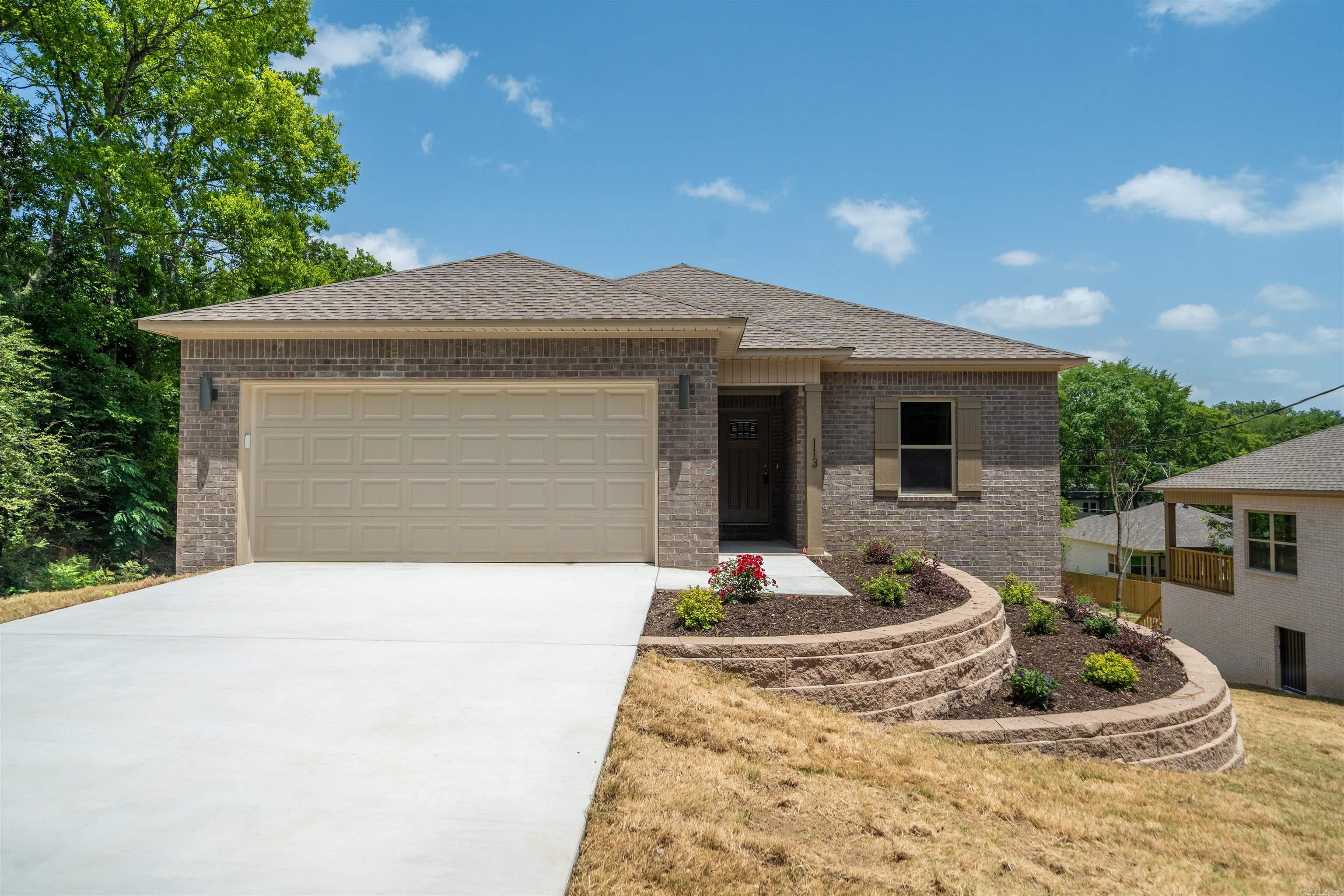 Discover quality craftsmanship and modern comfort in this beautiful new construction home featuring 3 bedrooms, 2 bathrooms, and 1,427 square feet of thoughtfully designed living space. Conveniently located near shopping, dining, schools, and everyday amenities, this all-electric home offers an open-concept floor plan with premium Shaw Luxury Vinyl Plank flooring throughout. The stylish kitchen features quartz countertops, abundant cabinetry, and flows seamlessly into the spacious living and dining areas. The private primary suite includes a walk-in closet and beautifully appointed walk-in shower, while added insulation between rooms enhances privacy and comfort. Built for efficiency and low maintenance, the home includes central heat and air, an insulated garage door and insulated garage walls, fiberglass exterior doors, brick exterior, vinyl soffits, and a crawlspace foundation. An irrigation system on a separate meter helps reduce water costs while keeping the lawn looking its best. Move-in ready and built with quality in mind, this is an exceptional opportunity to own a brand-new home in a highly desirable location.