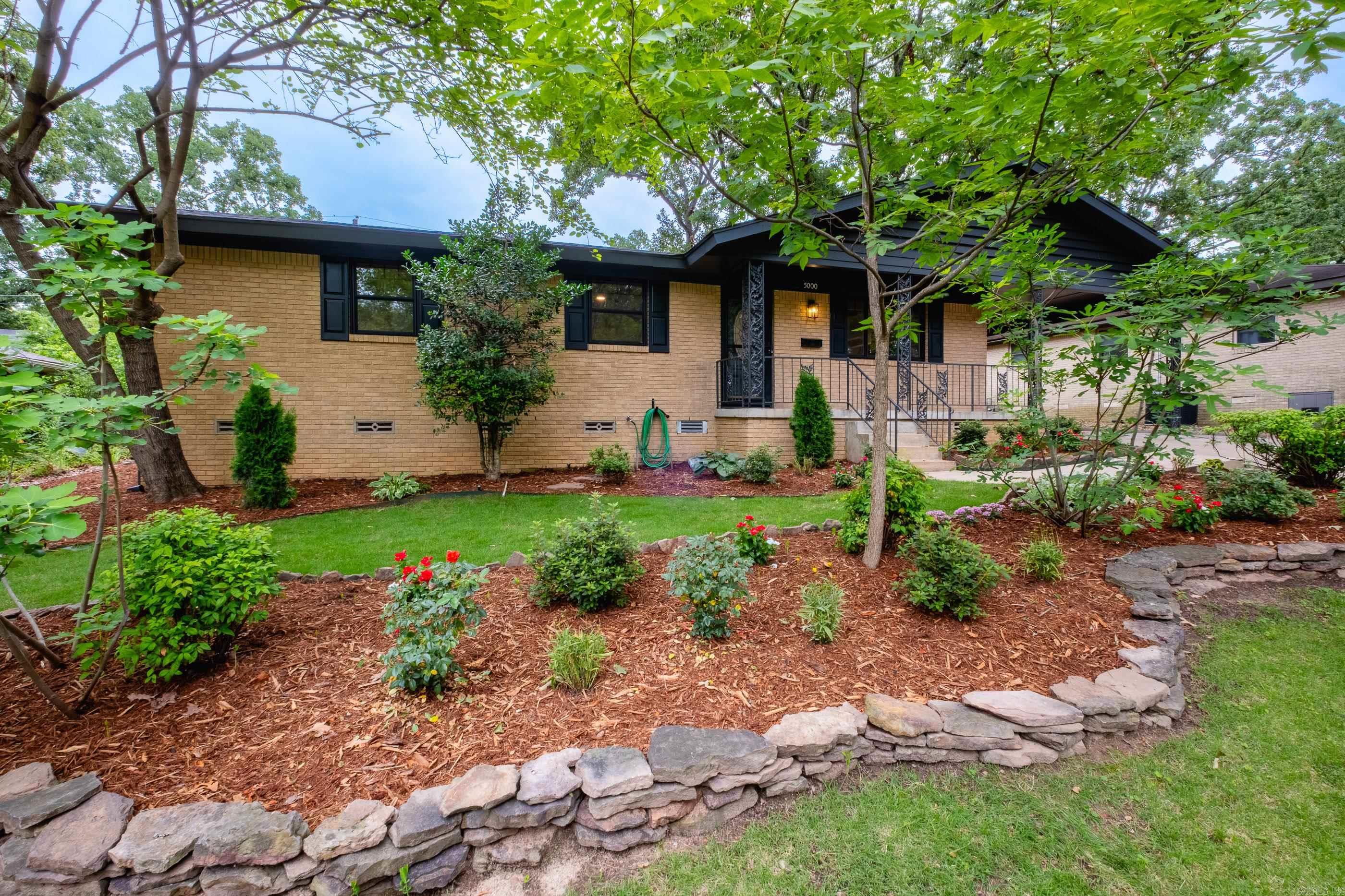 Welcome home to this beautifully updated brick home in the heart of Lakewood.  Featuring 3 spacious bedrooms & 2 full baths, this move-in-ready home blends timeless charm with modern updates throughout. The inviting sunroom offers the perfect space to relax or entertain. the updated kitchen is designed for style & functionality. Unique rock fireplace in family room with orgeous hardwood floors. New LTV flooring in kitchen & sunroom. Situated on large lot, the property boasts beautifully landscaped grounds.