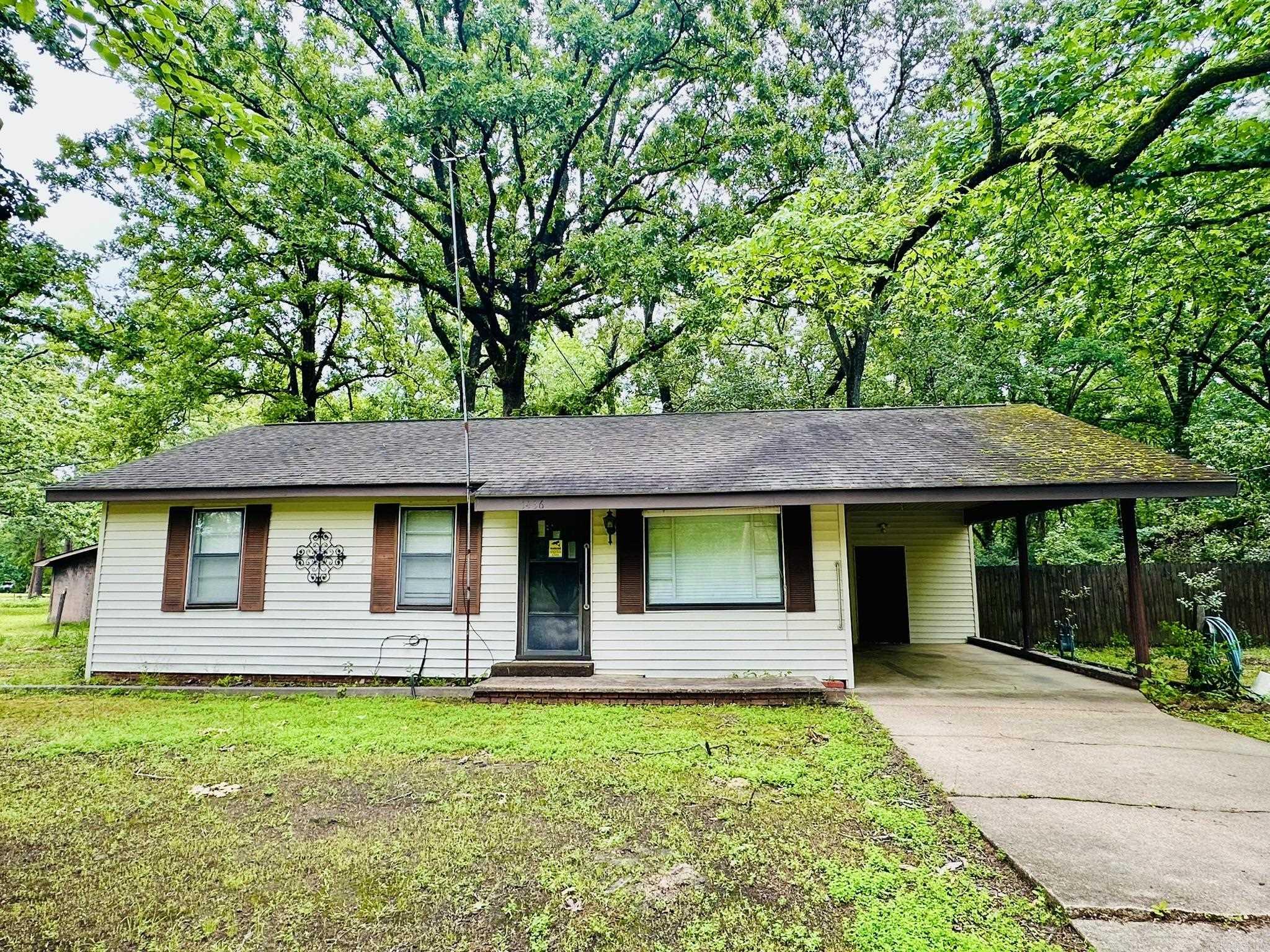 Looking for a great investment?  This property has two homes on it.  One is an older 840 sq ft house with 3 bedrooms and 1 bathroom.  Newer walk-in shower. Laundry room is located under to carport and also has a covered patio.  The ac/heat wall unit is about a year old.  All appliances will convey.  Both properties sit on 1.14 acres (corner lot) which includes a large shop with electricity.  Second home has 480 sq ft (physical address is 405 W Pierce). Kitchen/living room and one bedroom and one bathroom.  The bathroom needs some TLC. Roof and plumbing work need to be done.  Appliances will also convey with the smaller home. Properties are being sold together and will be sold "AS IS".