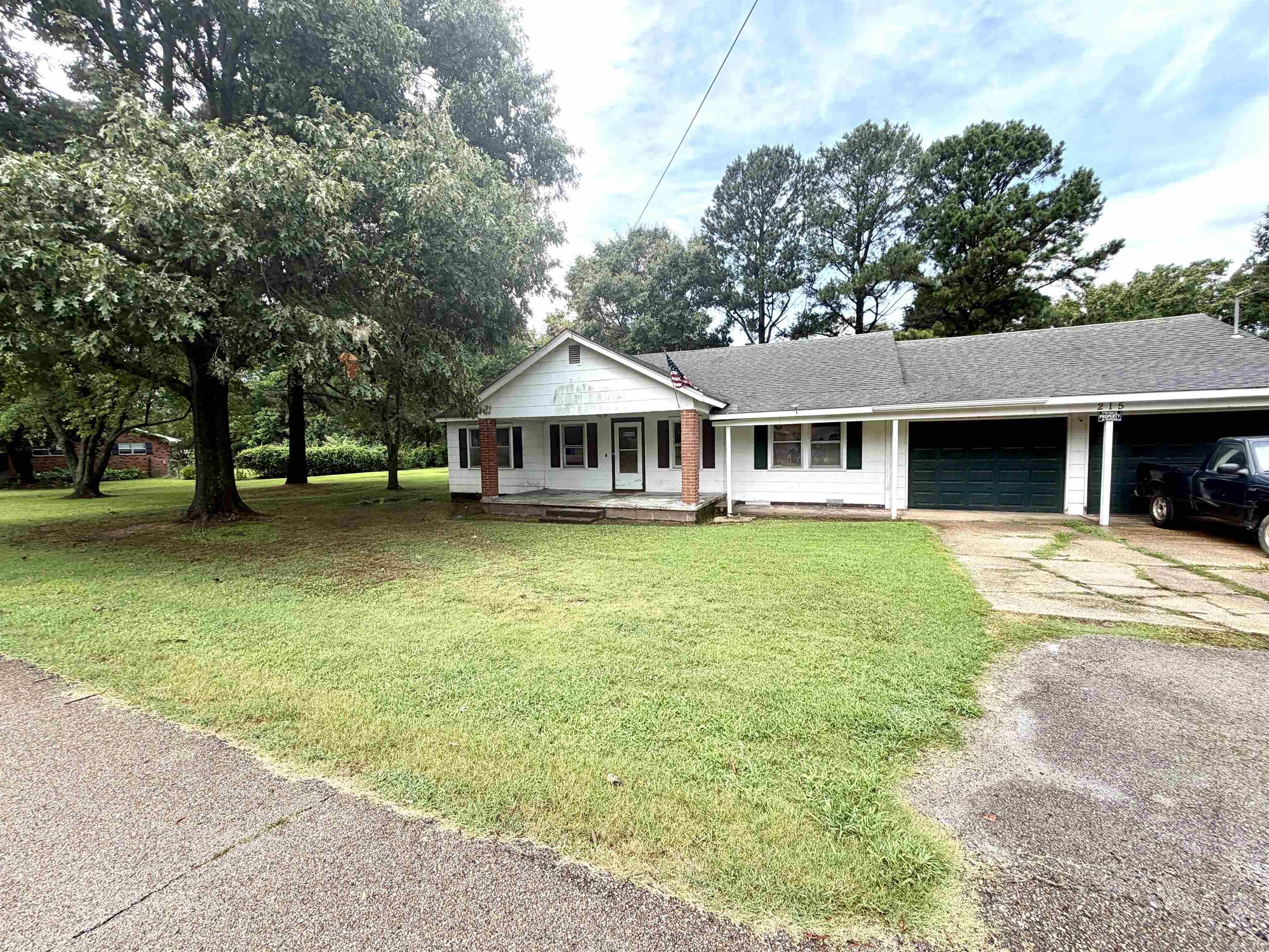 Charming 1,800 sqft,  3-bedroom, 1-bath home situated on a spacious 0.40-acre corner lot. This home as so much potential with a little TLC you will find original hardwood floors that add warmth and character throughout much of the home. The functional floor plan includes a dedicated office space, a separate laundry room, and a spacious 2-car garage. Outside, you'll find a 10x16 storage shed with an attached lean-to, providing ample space for tools, lawn equipment, or hobbies. Part of the large corner lot is already fenced for your fur baby or toddler to play. The HVAC system is approximately 4 years old, offering added value and peace of mind. With its generous lot size, desirable corner location, and blend of classic charm and practical updates, this property is ready for its next owner. This home is ready for its new owner to make it perfect for them.