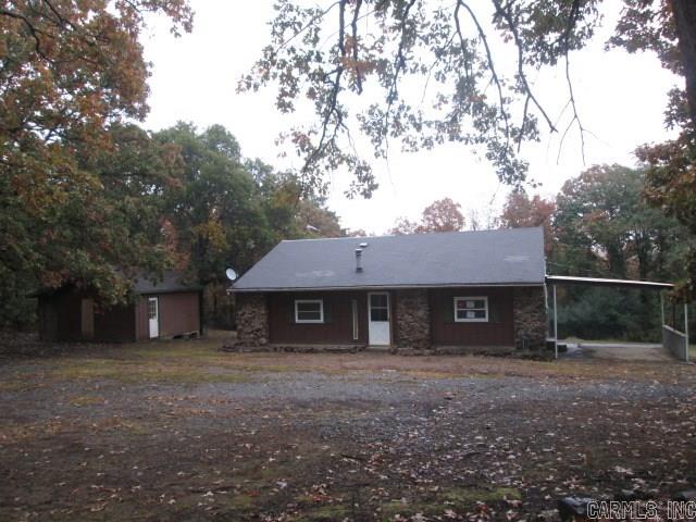 Rural location on large lot. One story rock and siding exterior walls with attached carport. The home features two bedrooms and one bathroom. Kitchen/living room is open and makes home feel larger than it is. House is vented for woodburning stove.
