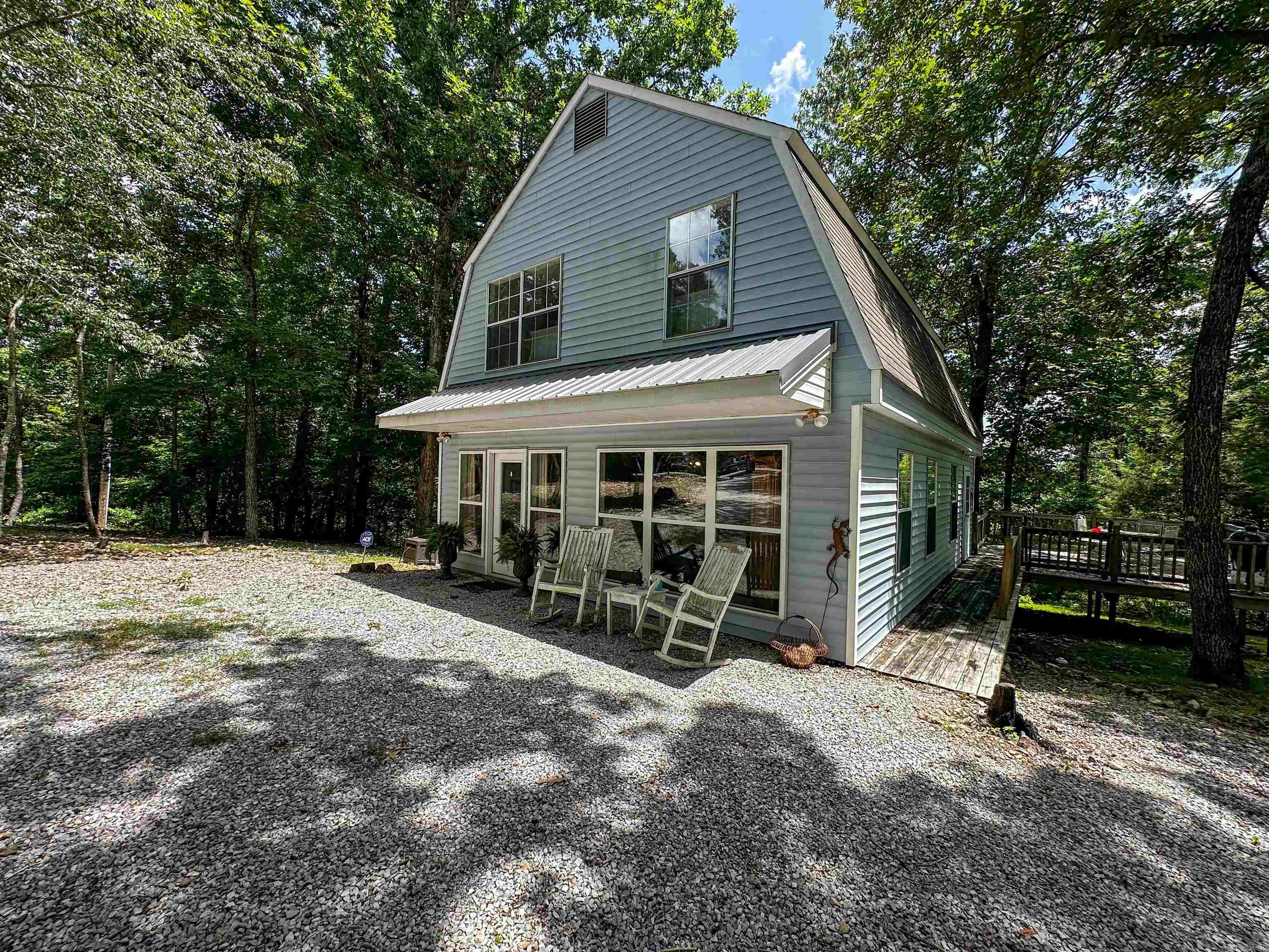 Welcome to your own private slice of the Ozarks! Nestled on 24.83 secluded acres at the very end of a dead-end road, this one-of-a-kind property offers unmatched privacy, peaceful surroundings, and the perfect blend of comfort and convenience. Located less than 5 minutes from the world-famous White River and only 10 minutes from the heart of Mountain View, you'll feel worlds away while remaining close to everything you need. The beautifully maintained 1,496 sq. ft. main home features 2 bedrooms and 1.5 baths, complemented by a separate 900 sq. ft. guest house with 1 bedroom and 1 full bath—perfect for family, friends, or short-term rental income. A 30x40 detached garage provides abundant storage and workspace, plus an RV hookup for visiting guests or your own adventures. Spend your evenings around the firepit, unwind on the deck, and soak in the quiet beauty that surrounds you. Offered mostly furnished, this property is truly turnkey and ready to enjoy from day one. Whether you're searching for a private retreat, family getaway, income-producing investment, or forever home, opportunities like this are few and far between. Priced at $395,000