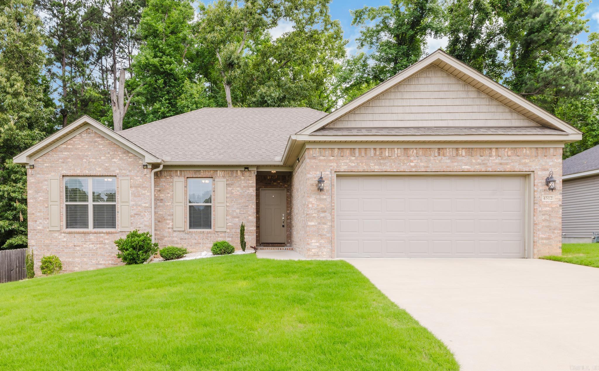 This beautiful 3BR/2BA home offers 1,539 square feet of comfortable living space with an open, light-filled floor plan. The kitchen features granite countertops, stainless steel appliances, a breakfast bar, and a pantry, making it perfect for both everyday living and entertaining. The spacious primary suite includes a walk-in closet and private bath. You'll also appreciate the dedicated laundry room as you enter the home from the garage. The garage is equipped with outlets for charging your electric vehicles! Step outside to enjoy the deck overlooking a fully fenced backyard that backs up to woods providing added privacy. Come see this one today before it's gone! *SEE AGENT REMARKS