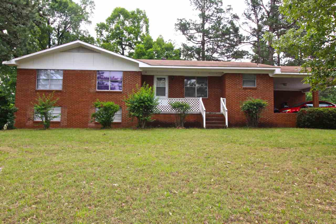 ALL BRICK COUNTRY HOME ON TWO ACRES OF ROLLING HILL GROUND, STORAGE BUILDING/DOG PEN, DOUBLE CARPORT AREA, WALK OUT BASEMENT W/ 4TH BEDROOM, FULL BATH AND GAMEROOM AREA, MAIN FLOOR THREE BEDROOMS, TWO BATHS, LAMINATE NEWER FLOORING, LOTS OF CABINETS IN KITCHEN, PANTRY, LAUNDRY ROOM, LARGE DINING AREA AND FAMILY ROOM, MAIN FLOOR 1772 SQ FT.AND BASEMENT W/STAINED CONCRETE FLOORS 778 SQ FT.