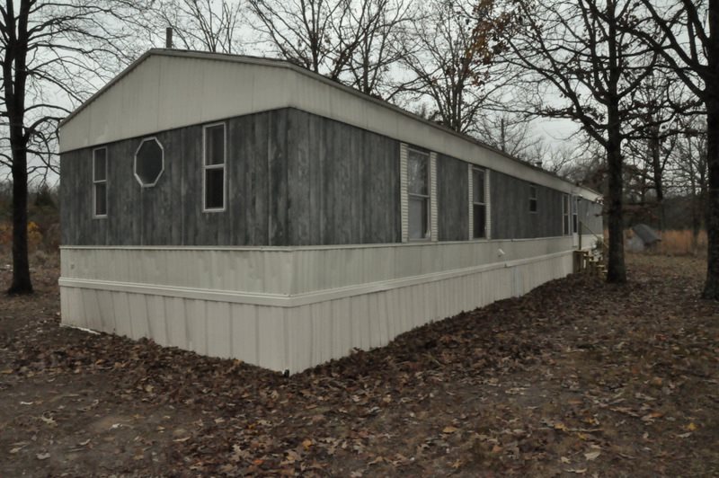 This SW home is a 16x78, 1248 sq. feet, 3 bedrooms, and 2 bathrooms re-furbed and re-newed with new paint and floor coverings on two private acres.