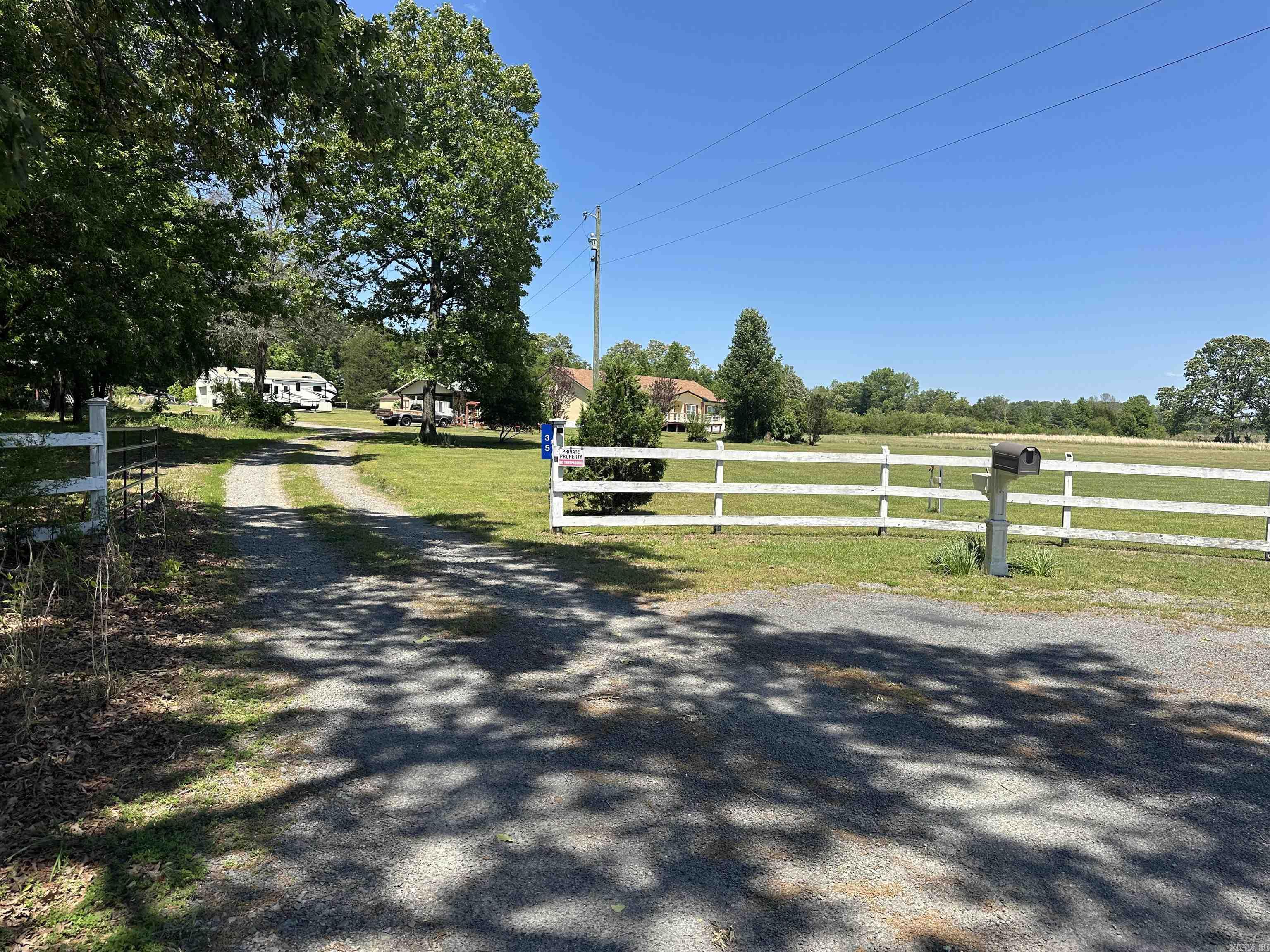 You will fall in love with this home as soon as you see it. This home is at the end of the road and secluded. The home offers 3 spacious bedrooms and 2 full baths, New 2026 HVAC and water heater. The roof is only 10 years old. There is a huge pantry and an office for your convenience. There is also an office and a full bathroom in the 30x40 shop. You have the convenience of city water but also the luxury of a deep artesian well. There are two storm shelters next to the home. The newer one is a 8x8 wheelchair accessible storm shelter that could have electric ran to it. The property is completely fenced in but there is a nice fence in the back yard with a beautiful deck to enjoy your morning coffee on. There are 3 septics on the property. Both carports on the property does convey. There is a huge gravel pad ready for you to build a second shop. Plus the sellers have an assumable loan of 2.125%. The home is a well maintained modular on a permanent foundation.