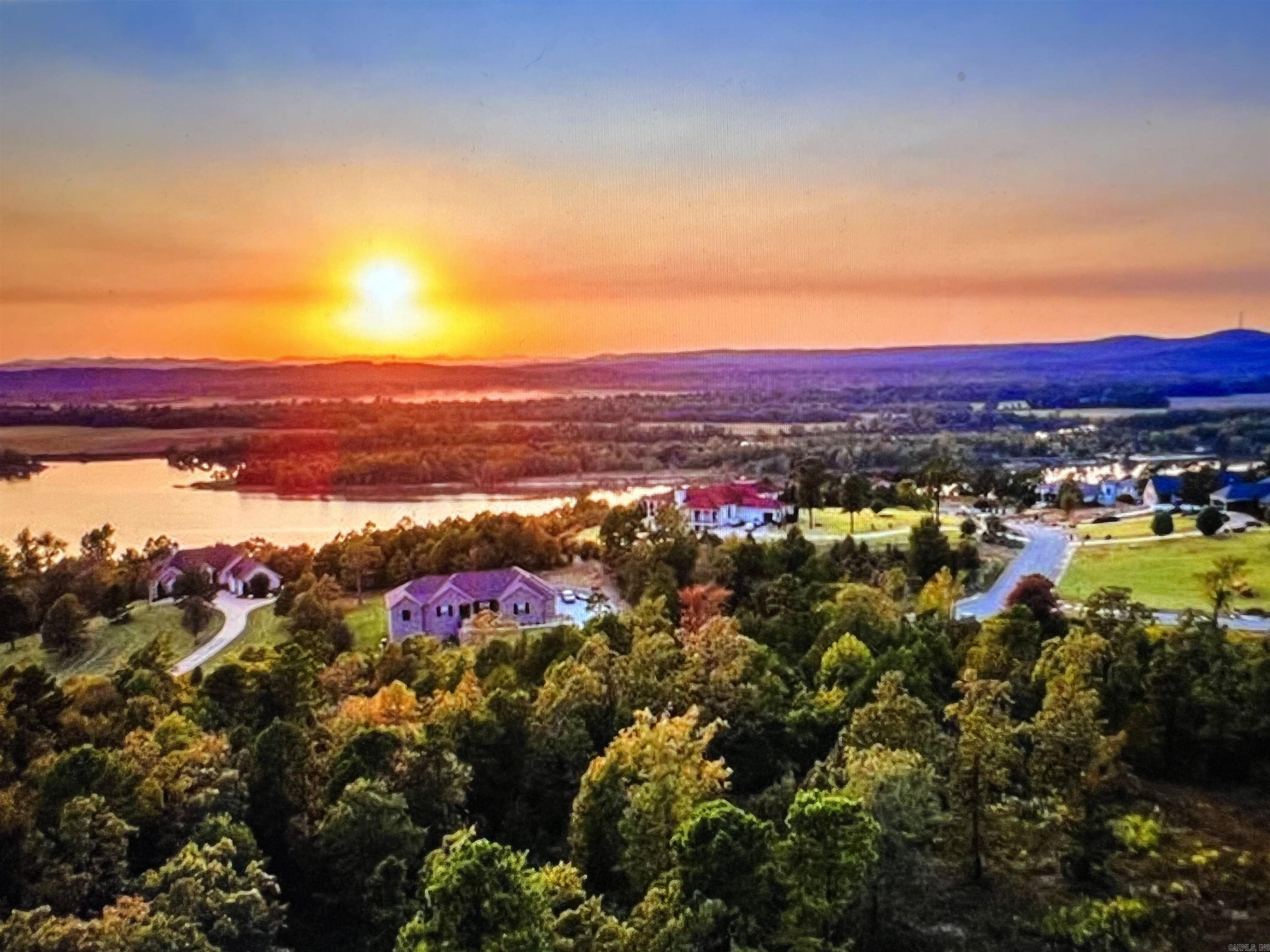 One of Maumelle's most sought after Gated Communities! Spectacular views of the Ar River and Pinnacle Mountain with Breathtaking Sunsets!! Why not wake up every morning with some of the most impressive views in Arkansas. Have you always wanted to design your own home? Let me help you make that dream a reality! Underground utilities to include; water, electricity, gas, sewer and high speed ATT internet! Minimum sq ft requirements are 2500 sq ft.  Gates are open on Sat and Sun from 1-4.