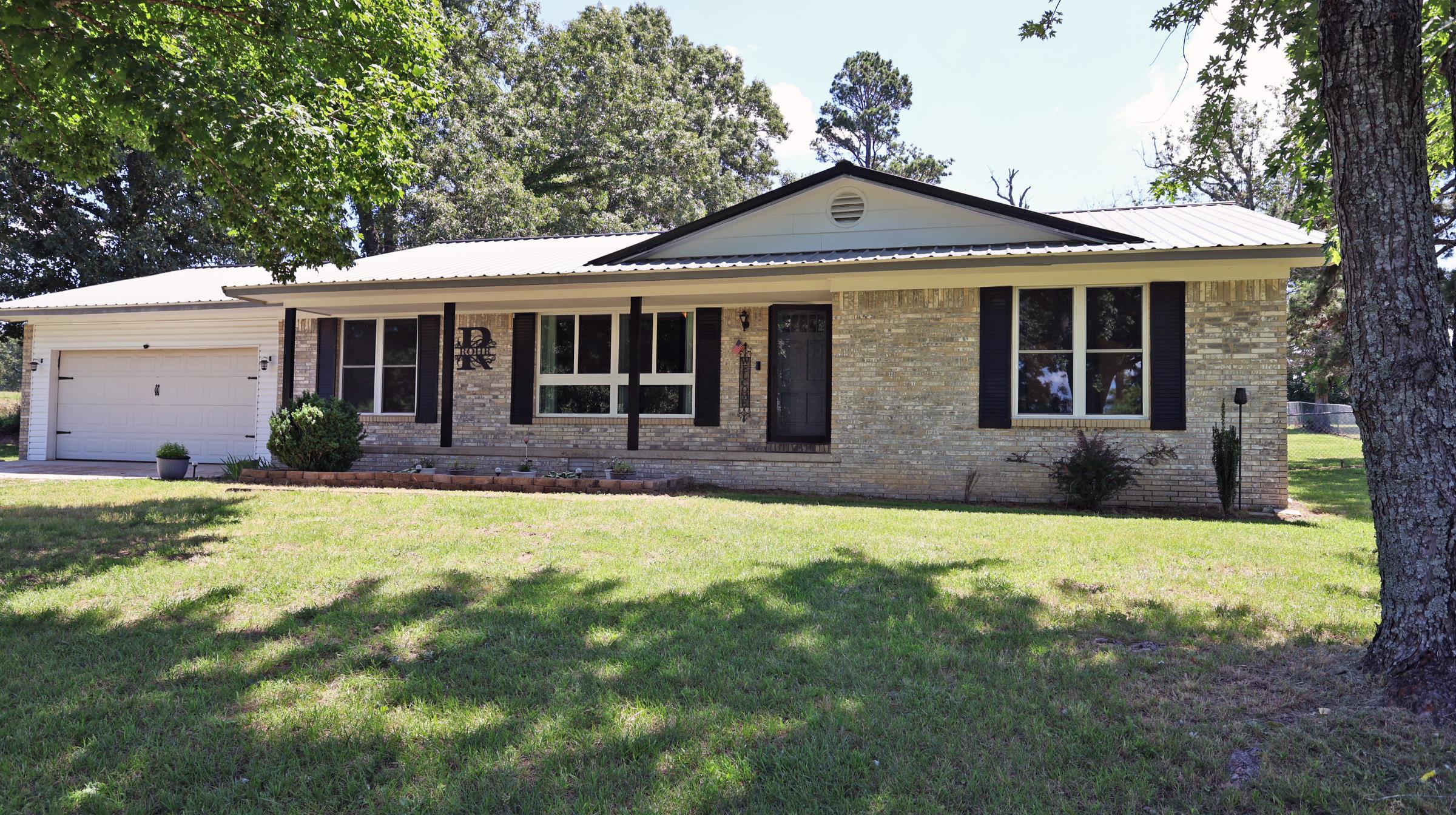 Move-in-ready 3-bedroom, 2-bath brick home situated on 1.99± acres between Melbourne and Brockwell in North Central Arkansas. This updated property offers convenient access to Melbourne schools, shopping, healthcare, and local amenities while providing a spacious country setting. The interior features new flooring throughout, central heat and air, a large living area, and an updated kitchen with stainless steel appliances, ample cabinetry, a large pantry, and a dedicated dining area. All appliances convey, including the 2021 top-load washer and electric dryer. Additional living space includes a large bonus or game room and an office area that could be used as a fourth bedroom, guest room, or hobby space. The oversized laundry room provides additional storage and functionality. The private primary suite includes a full bathroom. Exterior features include a storage building, two-car garage, and an interior-access storm cellar. Recent improvements include energy-efficient windows and doors, an updated roof, a new central heating and air system, upgraded electrical, and new flooring throughout. Listed at $229,000.