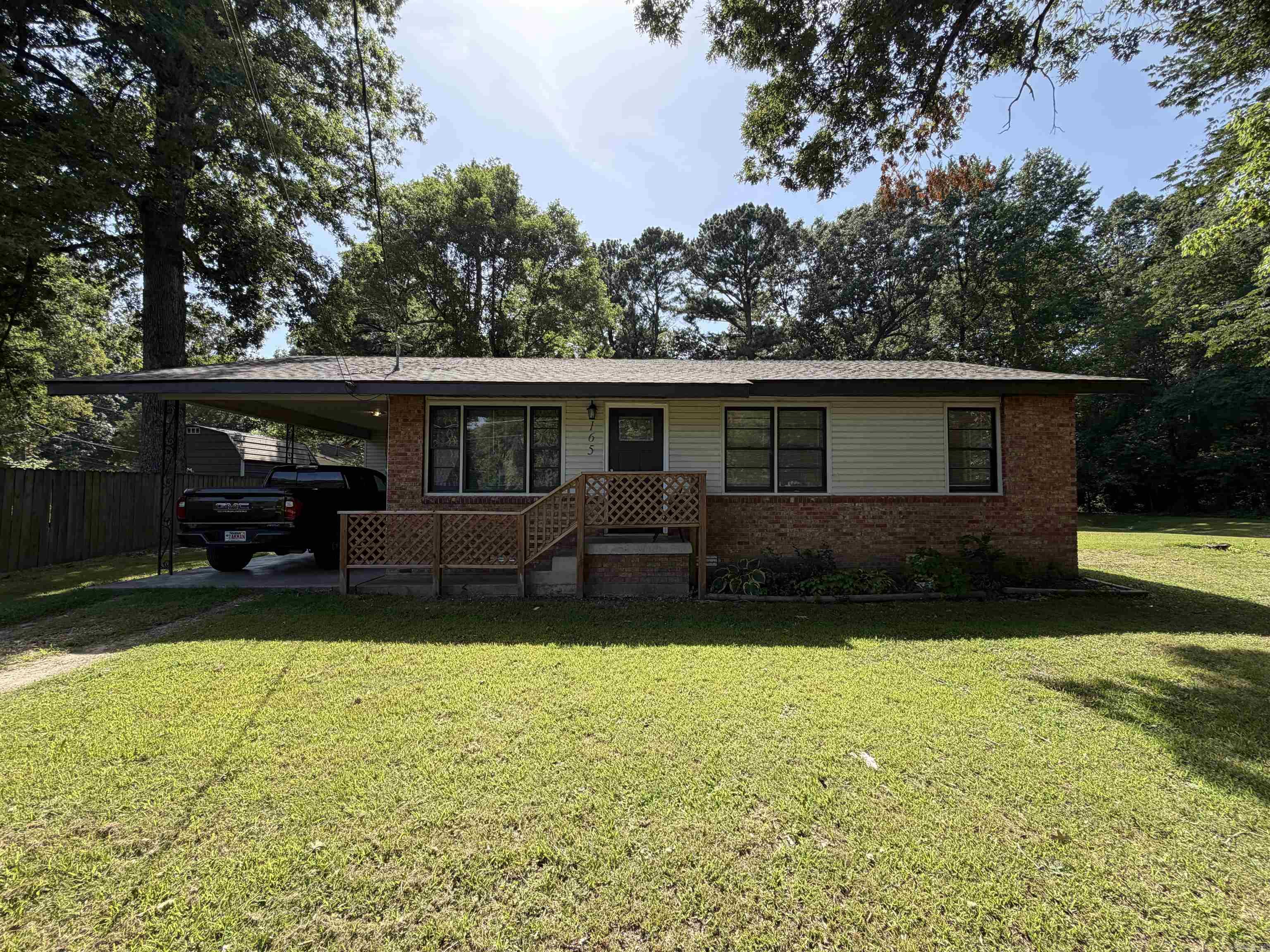 Welcome home to 165 S. 12th Ave., Piggott, AR 72454! This charming 3-bedroom, 1-bath home offers 1,092 square feet of comfortable living space and sits on a spacious 0.38-acre lot, providing plenty of room to enjoy the outdoors.  Recent improvements make this home move-in ready, including a brand-new roof and beautifully updated kitchen and bathroom. Whether you're a first-time homebuyer, looking to downsize, or searching for a great investment opportunity, this property offers both comfort and value.  Outside, you'll appreciate the convenience of a 1-car carport and a new 8x12 storage building, perfect for lawn equipment, tools, or extra storage. With its large yard, modern updates, and convenient location, this property is ready for its next owner.  Don't miss your opportunity to own this well-maintained home—schedule your private showing today!