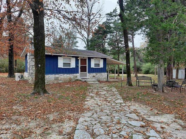 Looking for a weekend get-away, downsizing or investment, here it is!  A nice cottage with over an acre of nice laying land, close to downtown, shopping, school, hospital, collage and very short drive to river.  This home offers a 1 bedroom, 1 bath, open floor plane, carport, storm shelter, big lot great place for your dream home or make it your gathering place for family and friends.