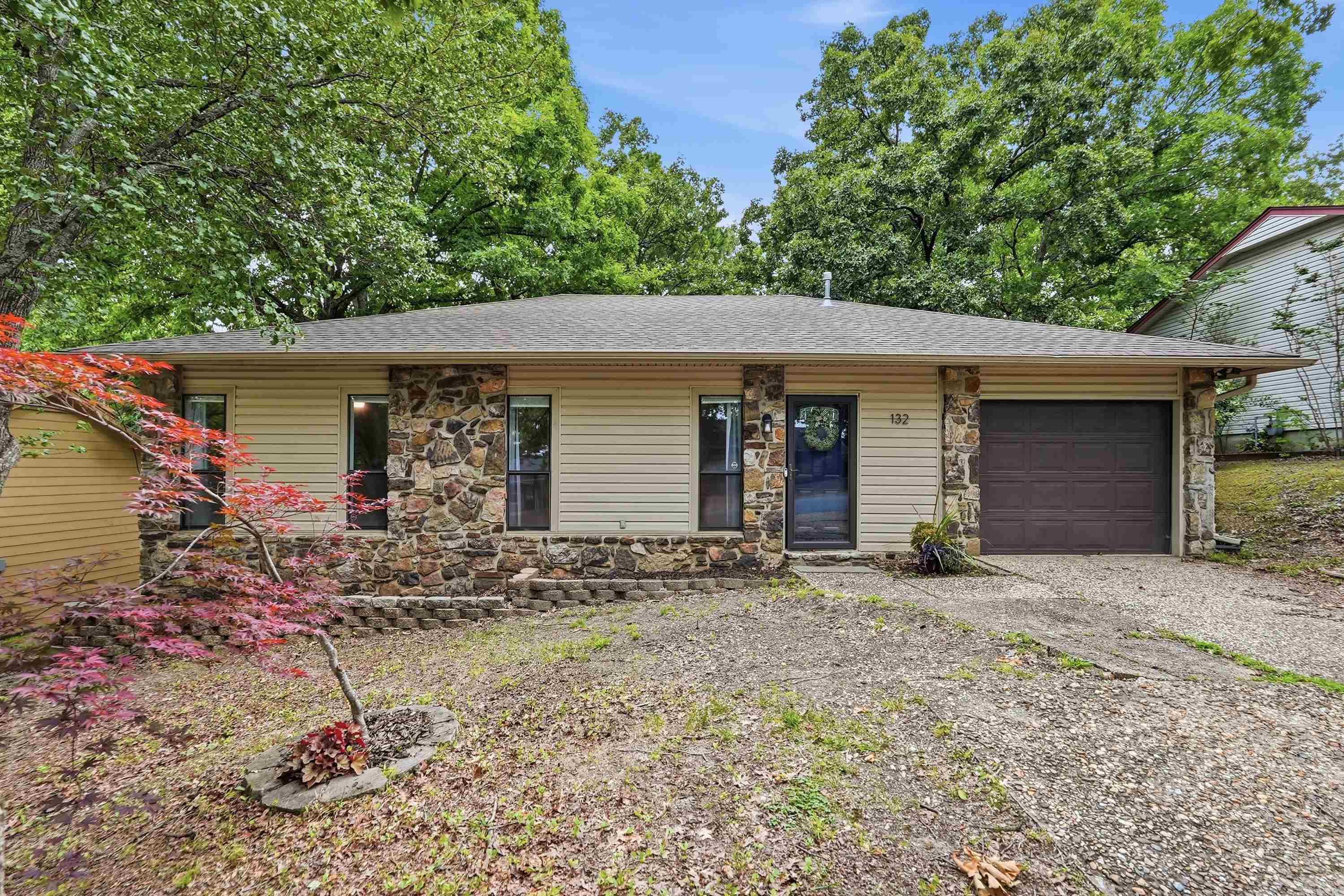 Welcome home to this charming one-level home in the heart of West Little Rock! Conveniently located near shopping, restaurants, and everyday amenities, this home offers comfort, convenience and exceptional value! Step inside to find a spacious living room with vaulted ceilings and a beautiful rock fireplace that creates a warm and inviting focal point. The open layout flows seamlessly into the kitchen and a versatile sunroom that can serve as a dining area, secondary living space, home office or playroom. All three bedroom are generously sized, and both the primary and guest bathrooms have been nicely updated. Just off the sunroom, you'll find a newly upgraded deck that's perfect for entertaining or simply relaxing outside and overlooks the fully fenced backyard. Don't miss this great home at and ever greater price!! Schedule via BrokerBay.